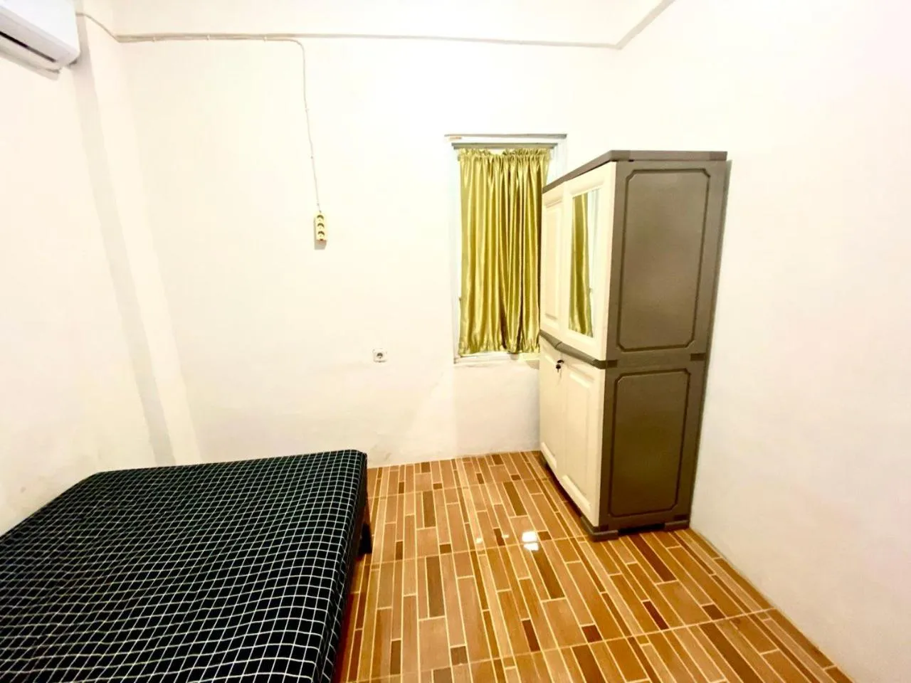 Bed in Kasmarani Homestay