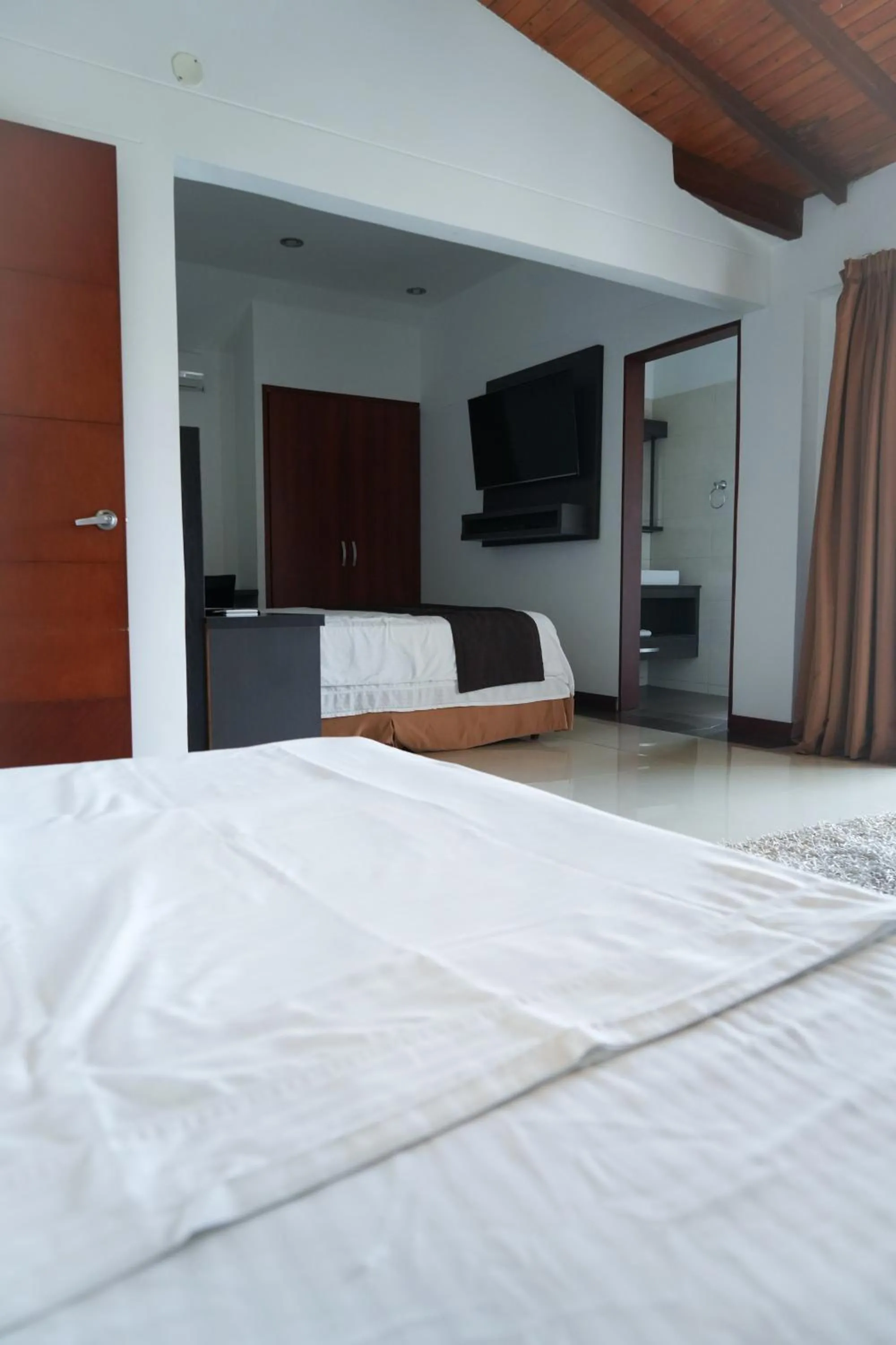 Bed in Serenity Suites Casa Boutique