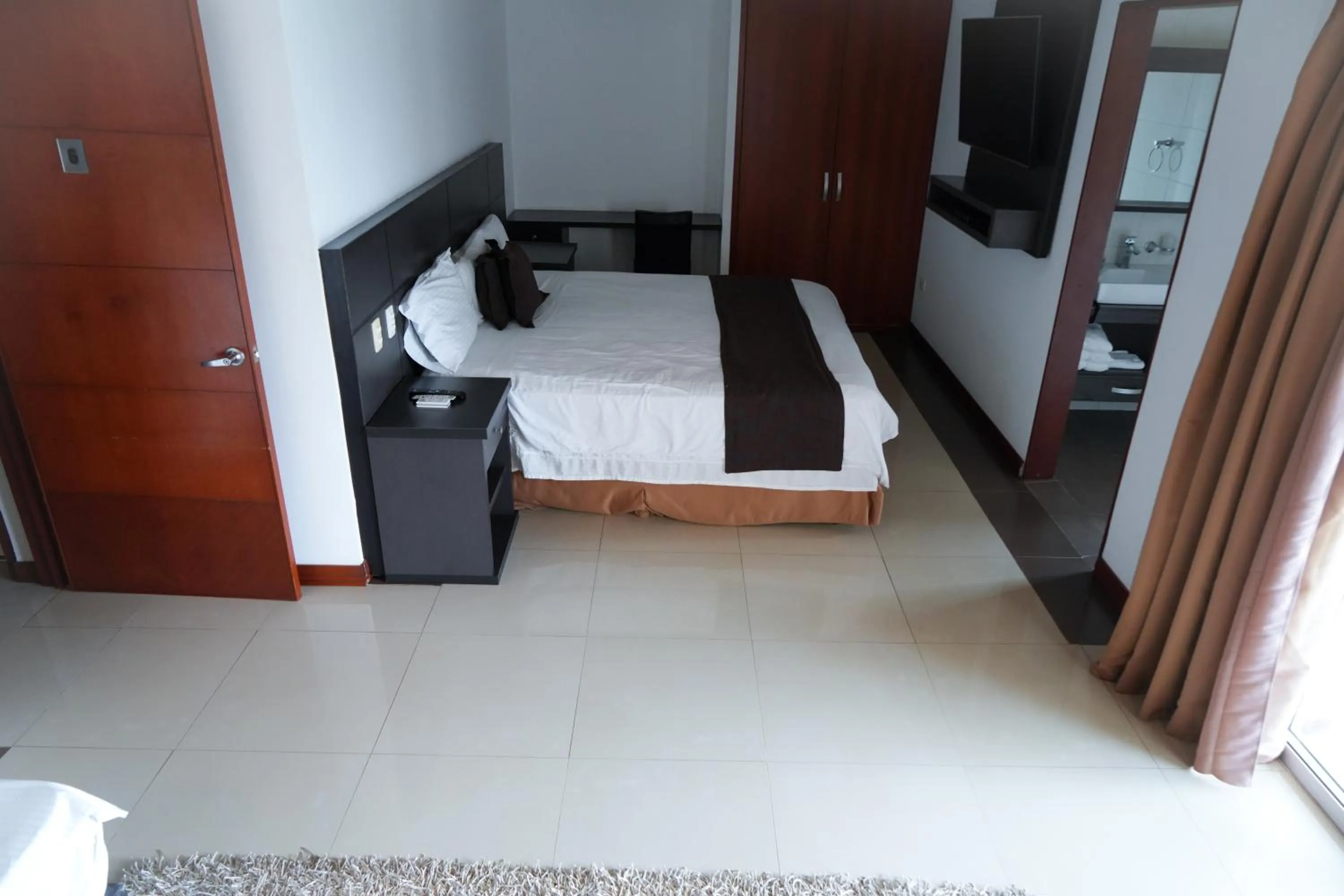 Bed in Serenity Suites Casa Boutique