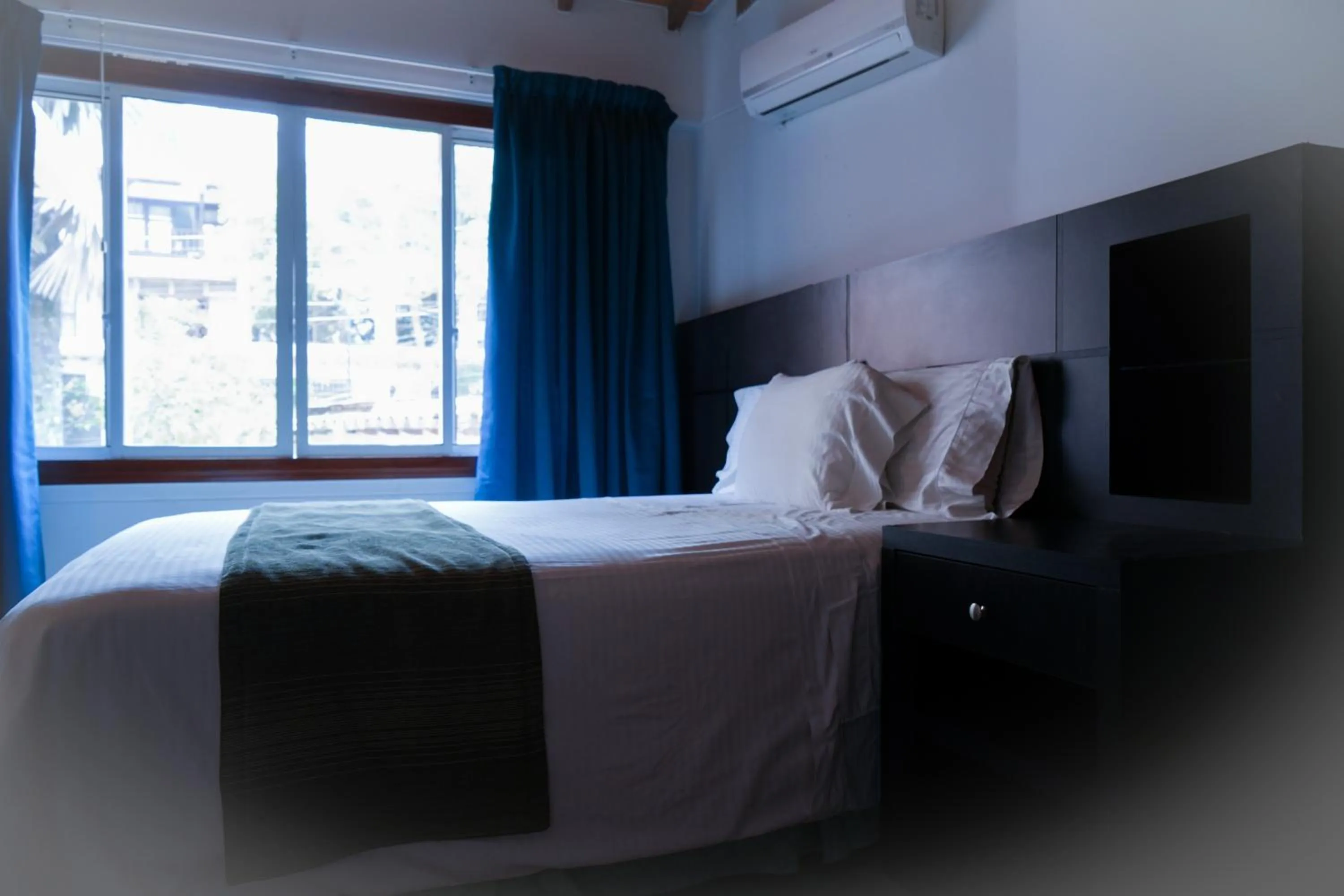 Bed in Serenity Suites Casa Boutique