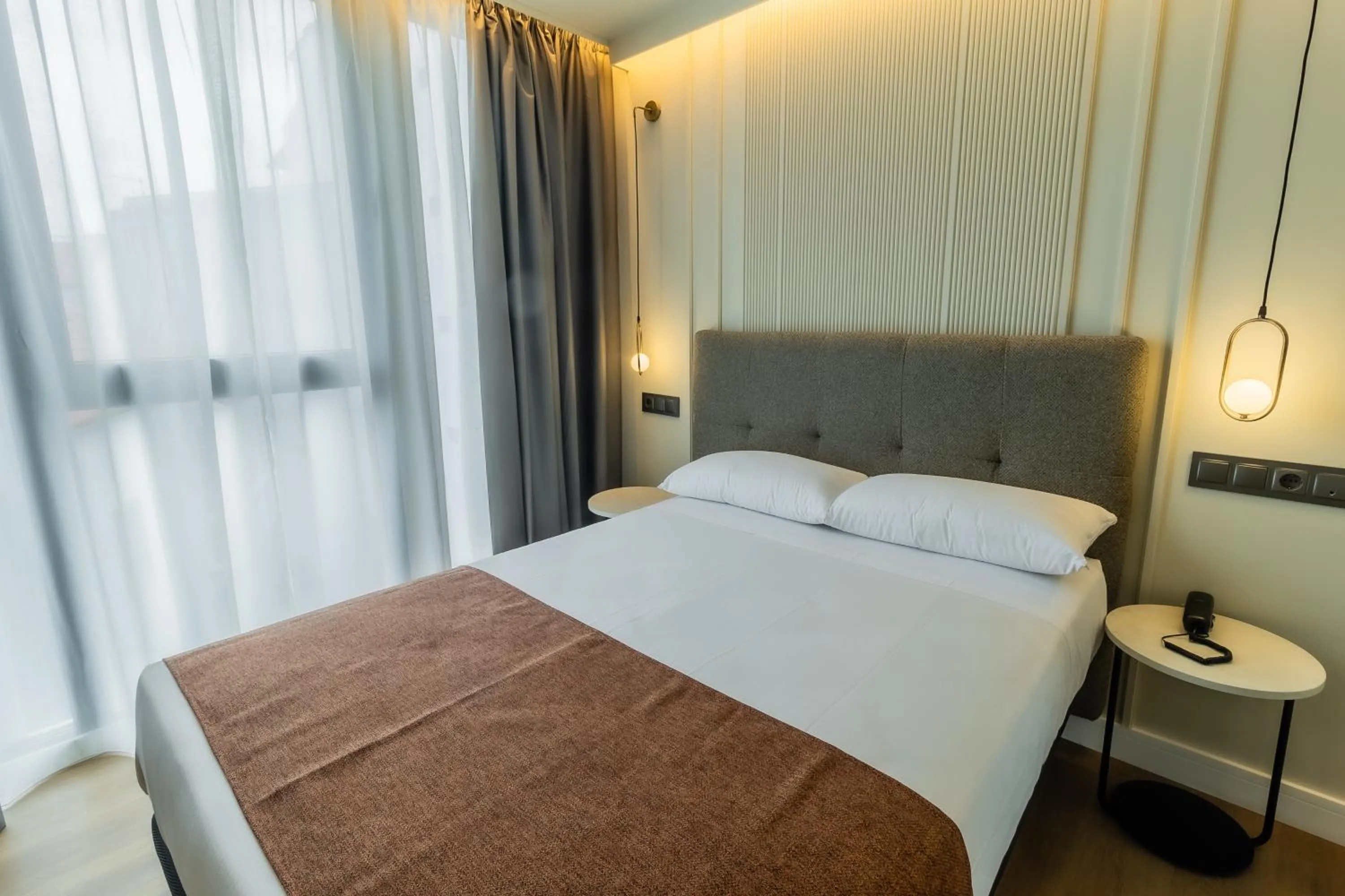 Bed in HOTEL CORONA DE PADRÓN