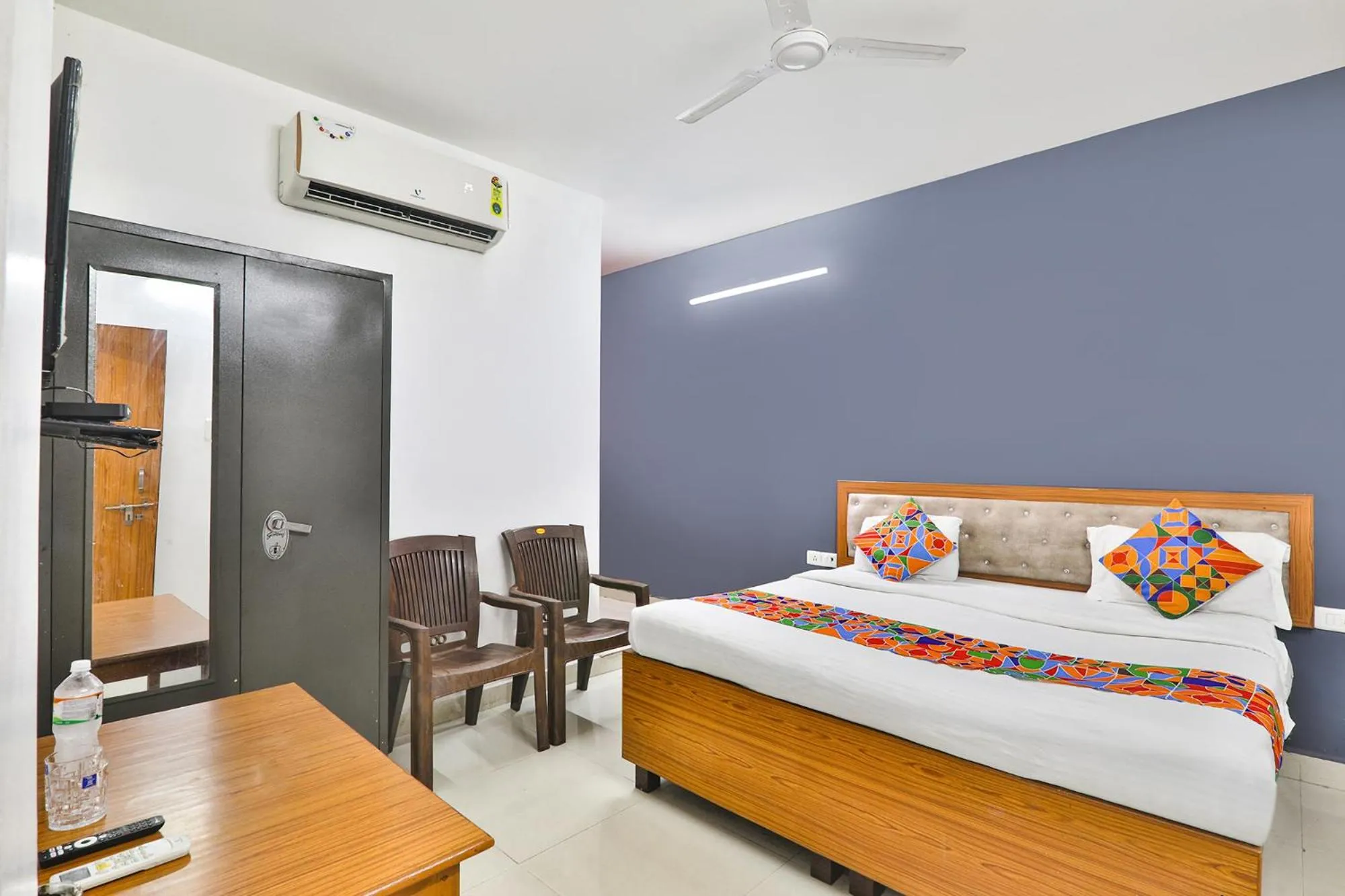 Bed in FabHotel Raas Inn