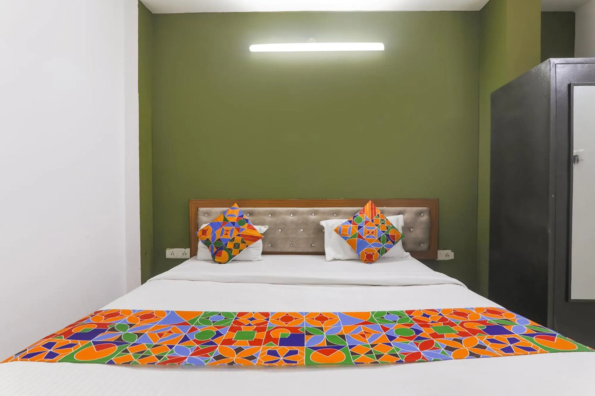 Bed in FabHotel Raas Inn