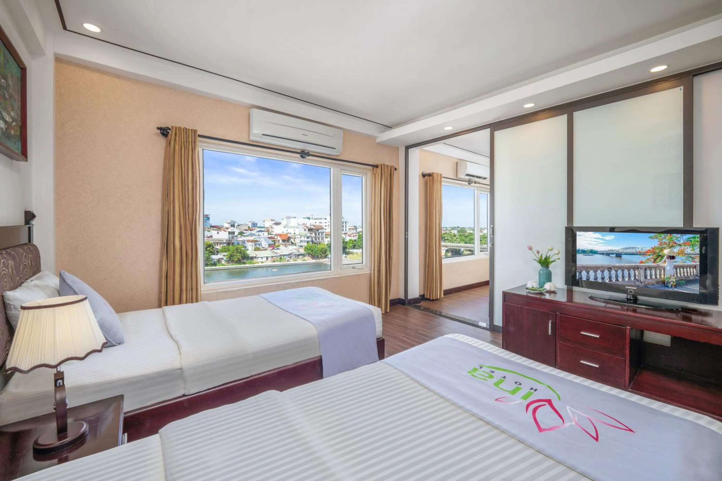 Communal lounge/ TV room, Bed in Vina Hotel Hue