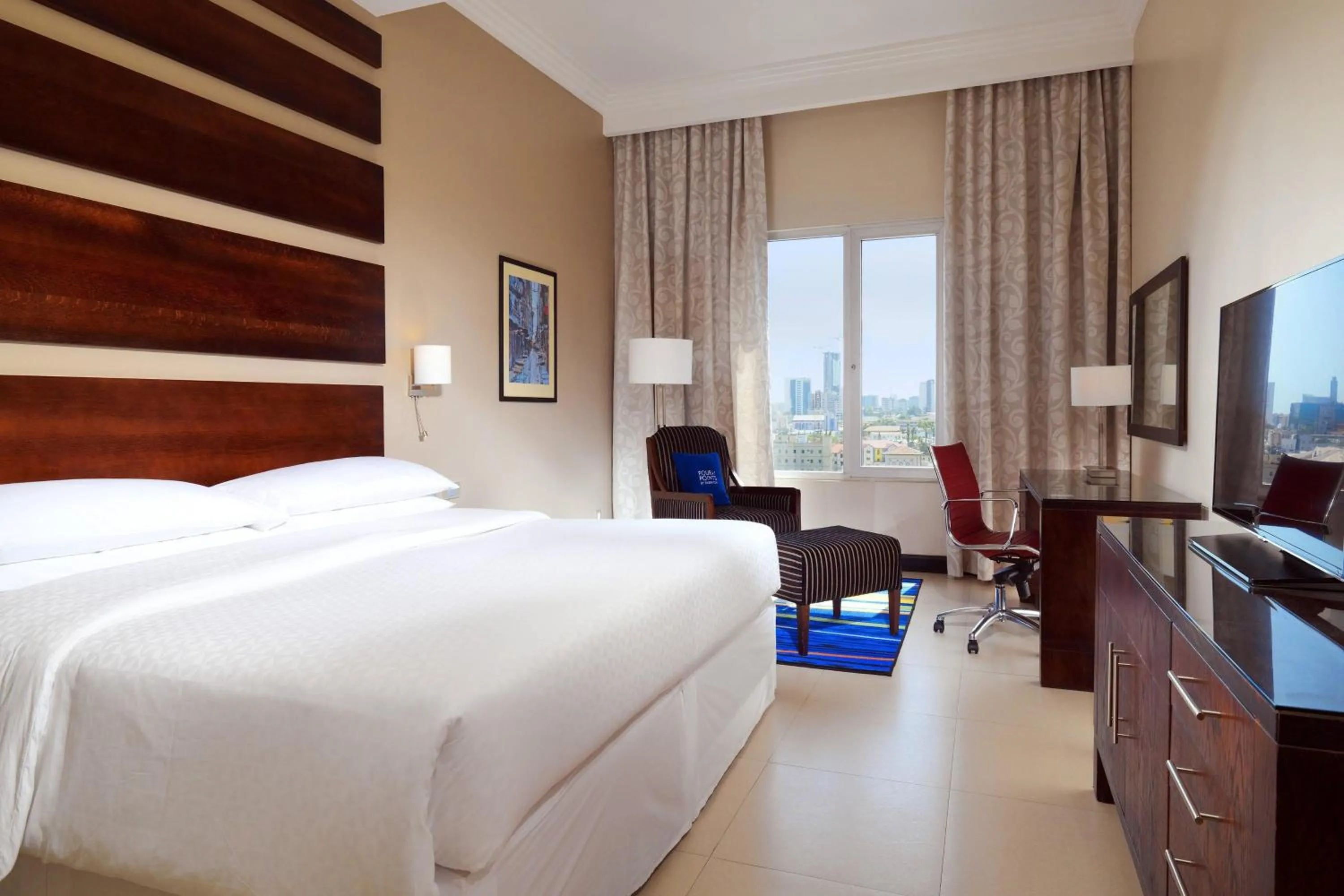 Photo of the whole room, Bed in Four Points by Sheraton Lagos