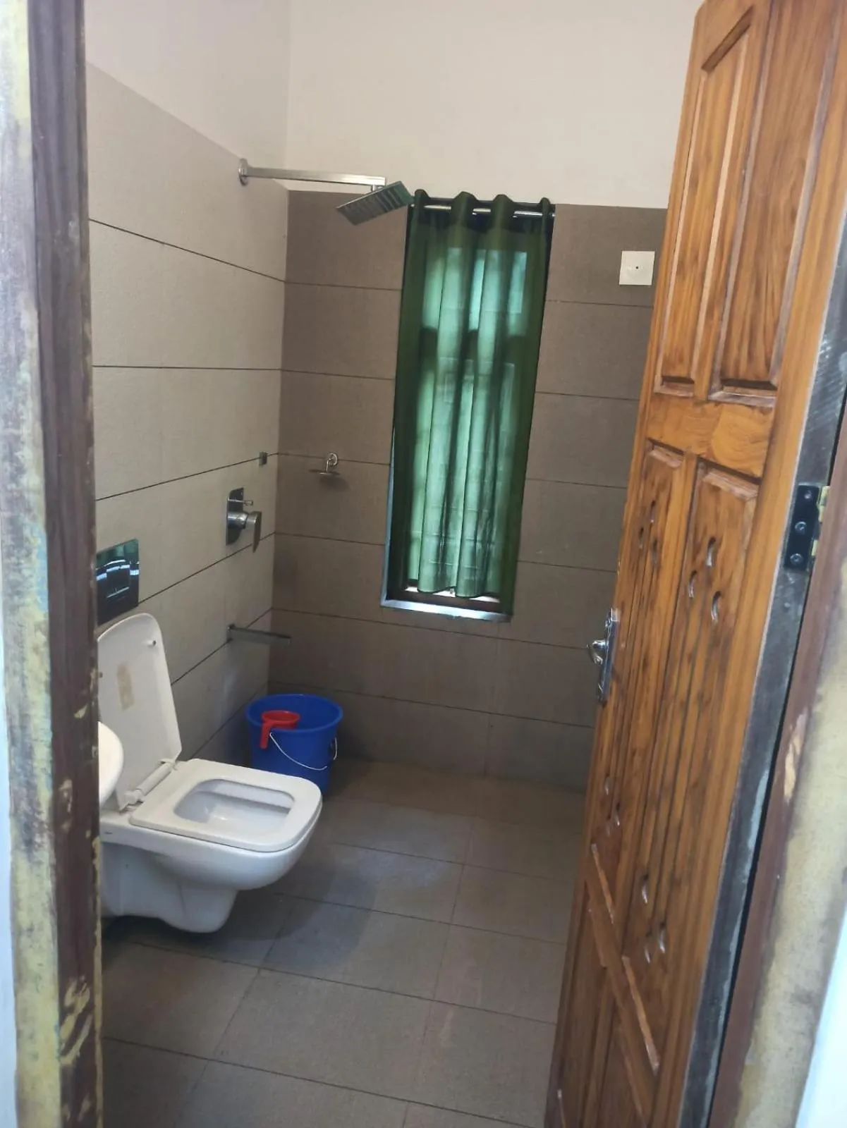 Shower in B'camp Resorts & Homestays