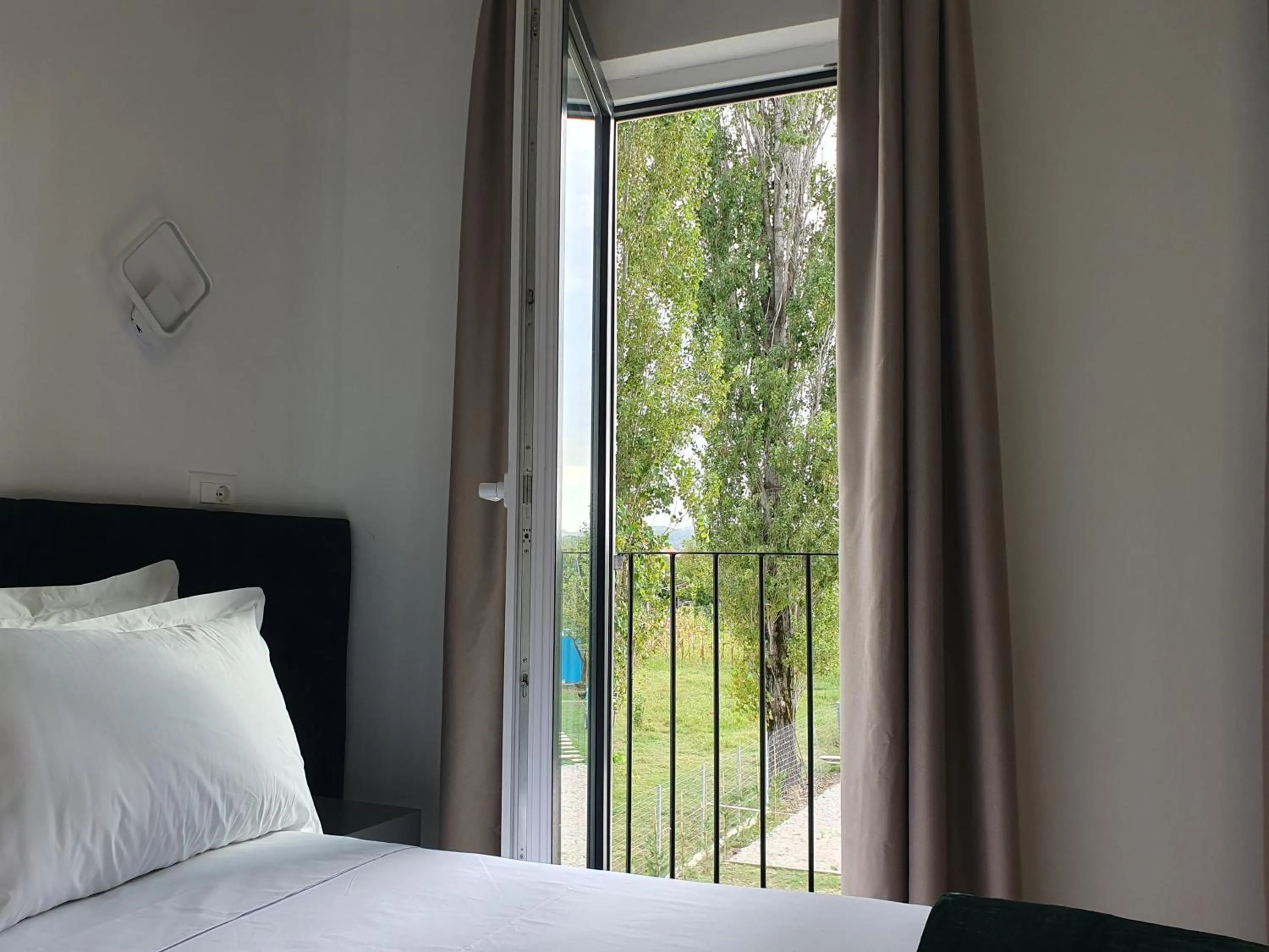 View (from property/room), Bed in Nerium Garden Inn Tirana Airport