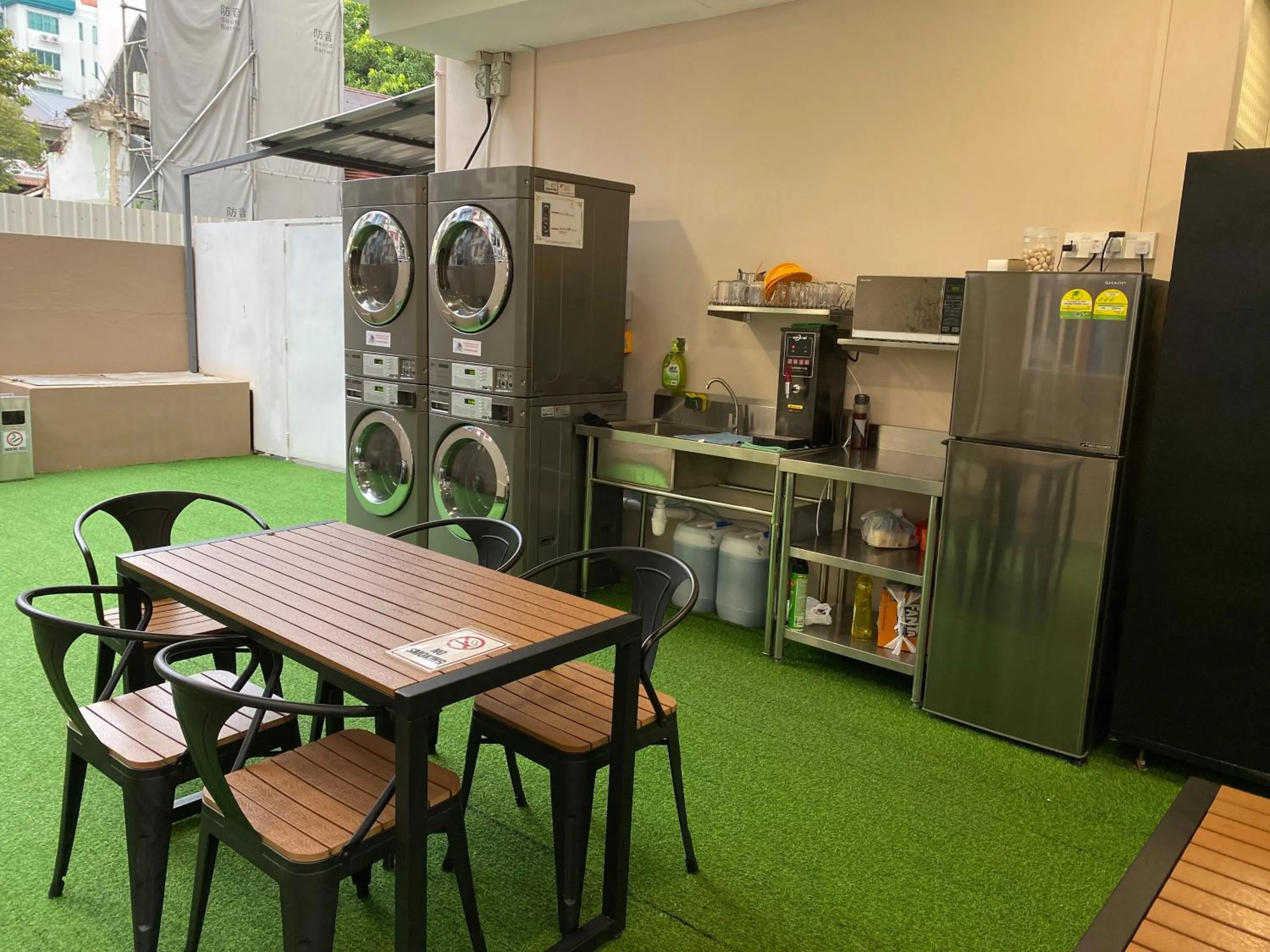 Communal lounge/ TV room in D'Nova Hotel Kallang