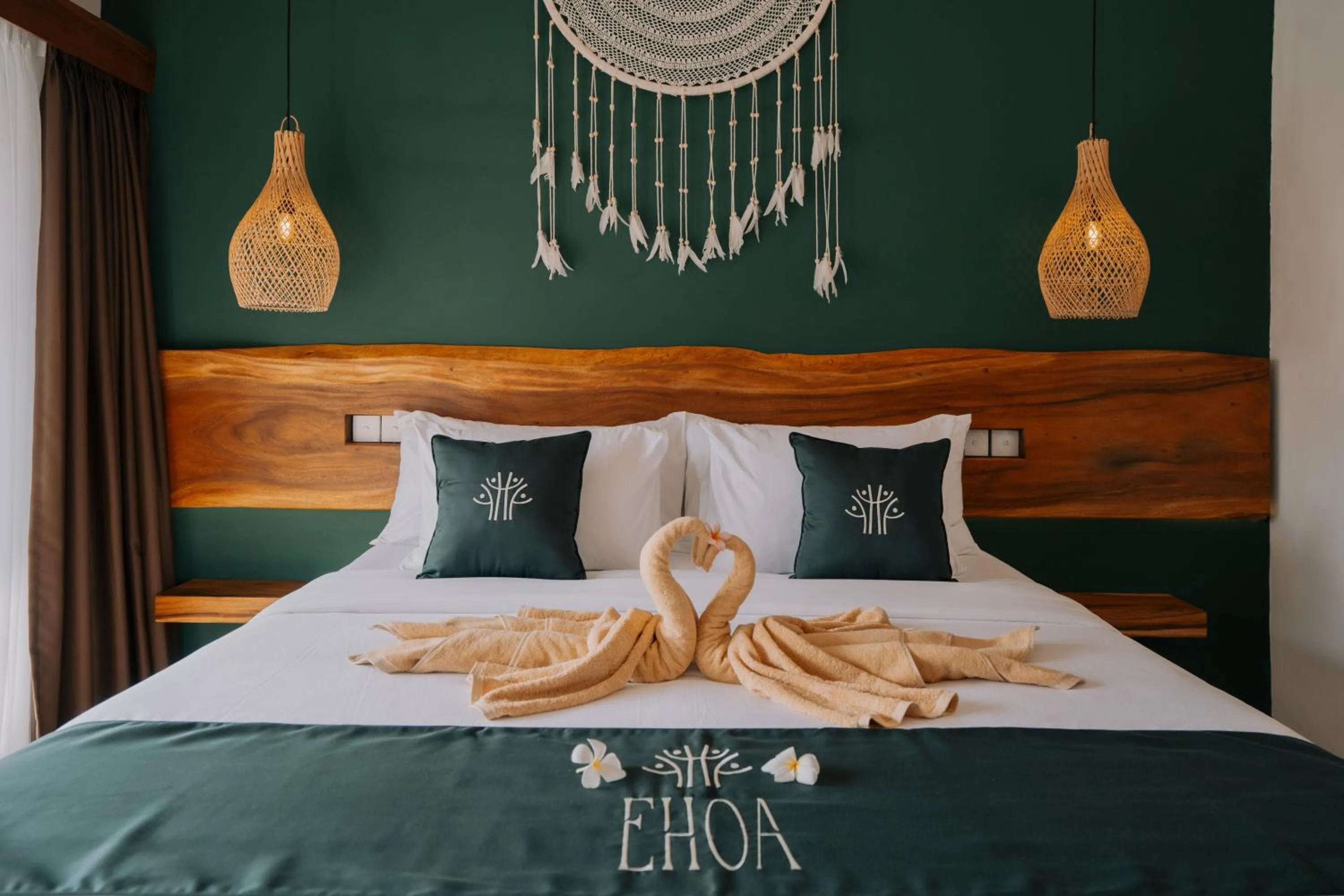 Bed in EHOA NYANYI BEACH Boutique Hotel - In front of entrance to NUANU