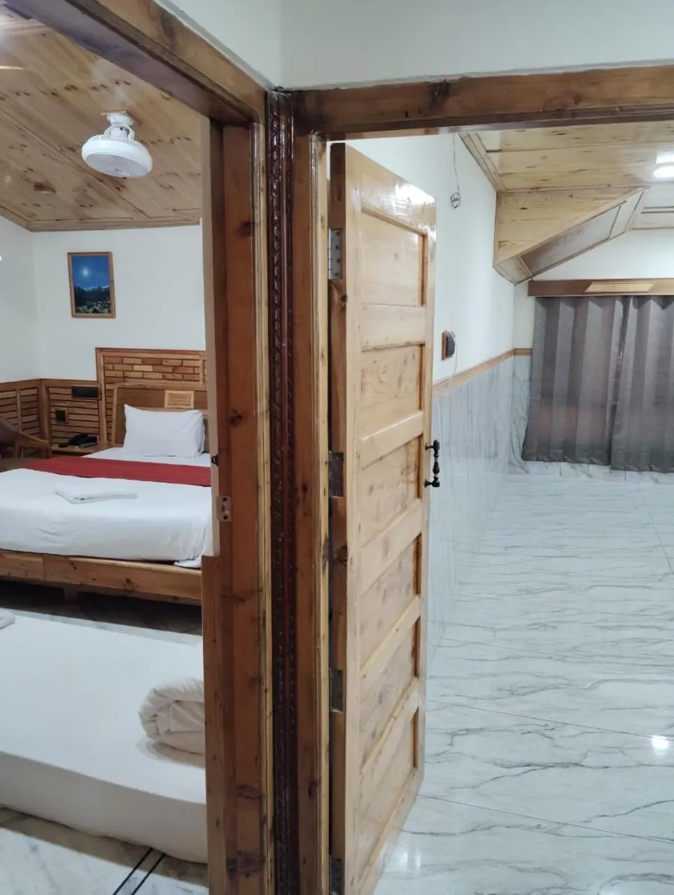 Bed in Hotel CM Palace - Pure Vegetarian