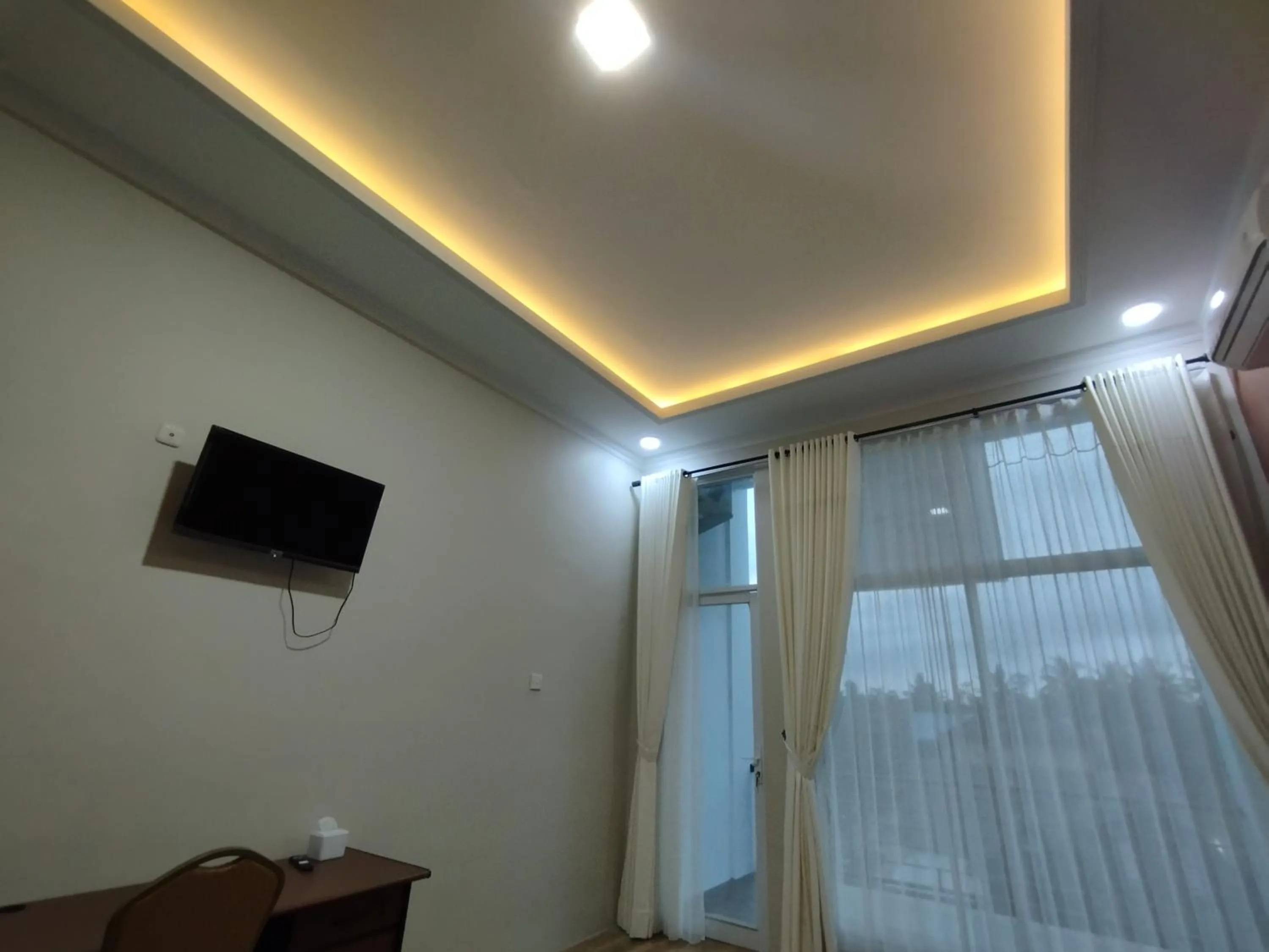 Communal lounge/ TV room in Saira Hotel dan Homestay Syariah