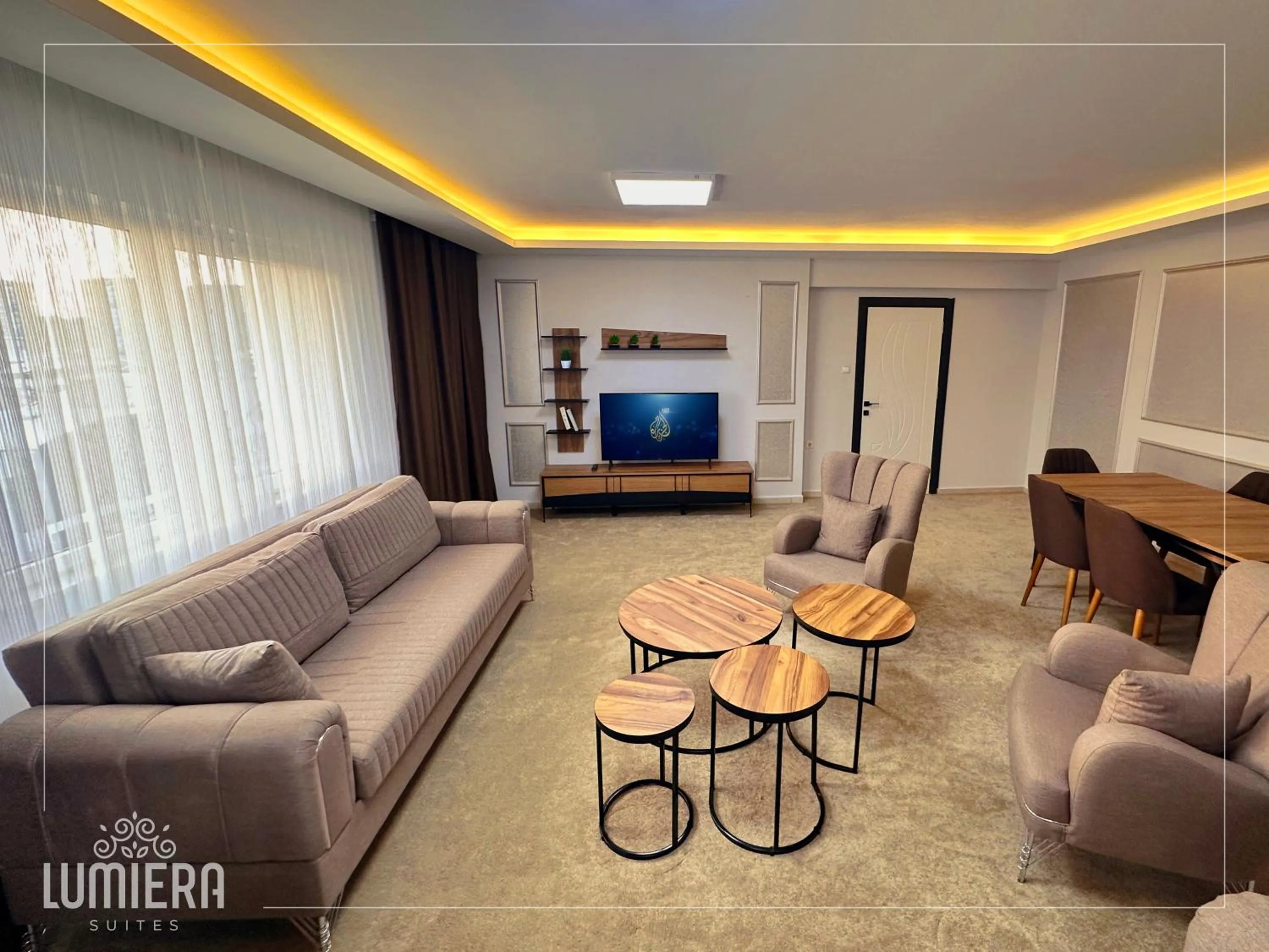 Communal lounge/ TV room in Lumiera Suites Hotel
