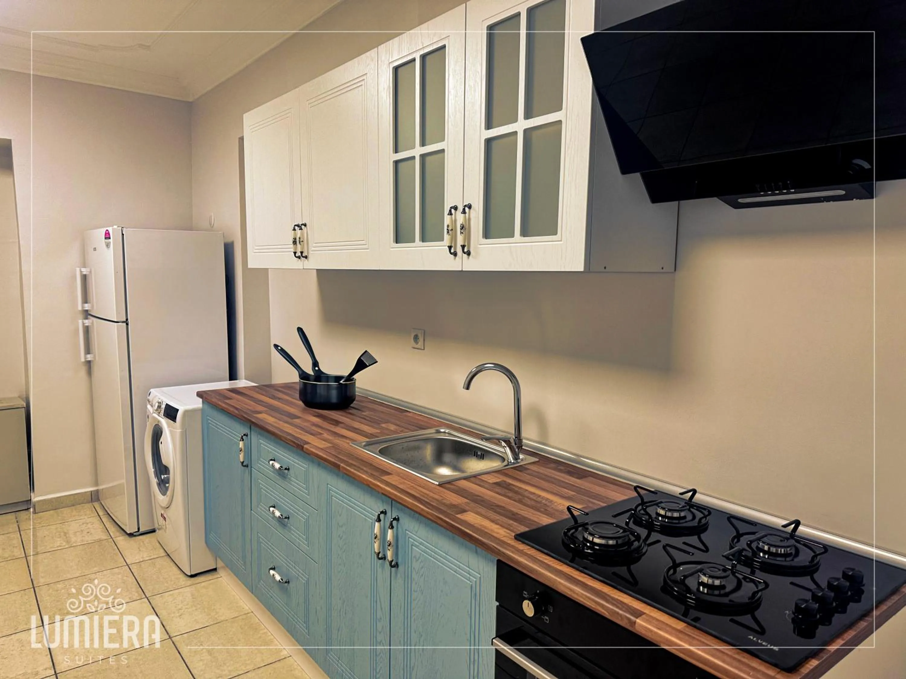 Kitchen or kitchenette in Lumiera Suites Hotel
