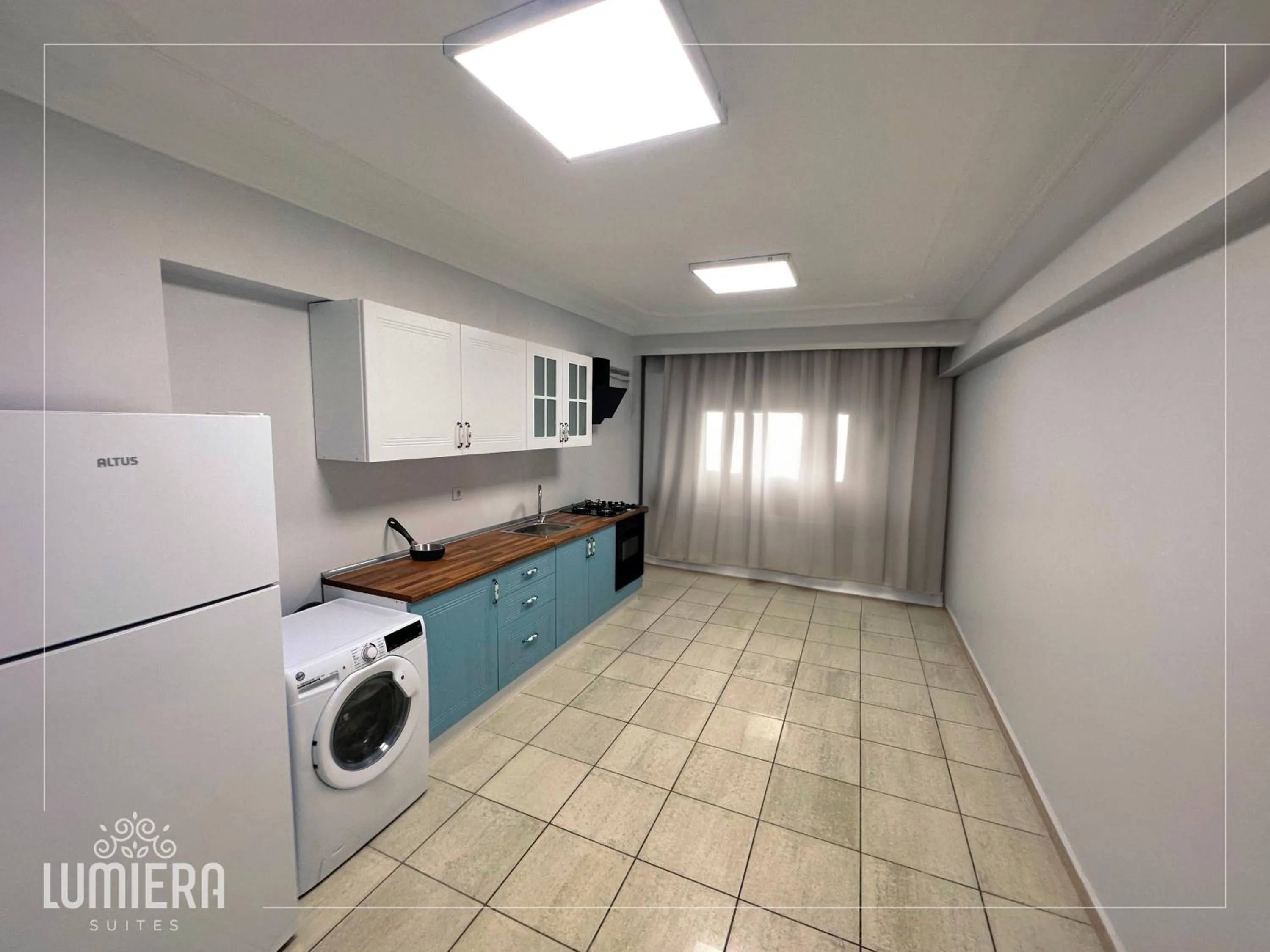 Kitchen or kitchenette in Lumiera Suites Hotel