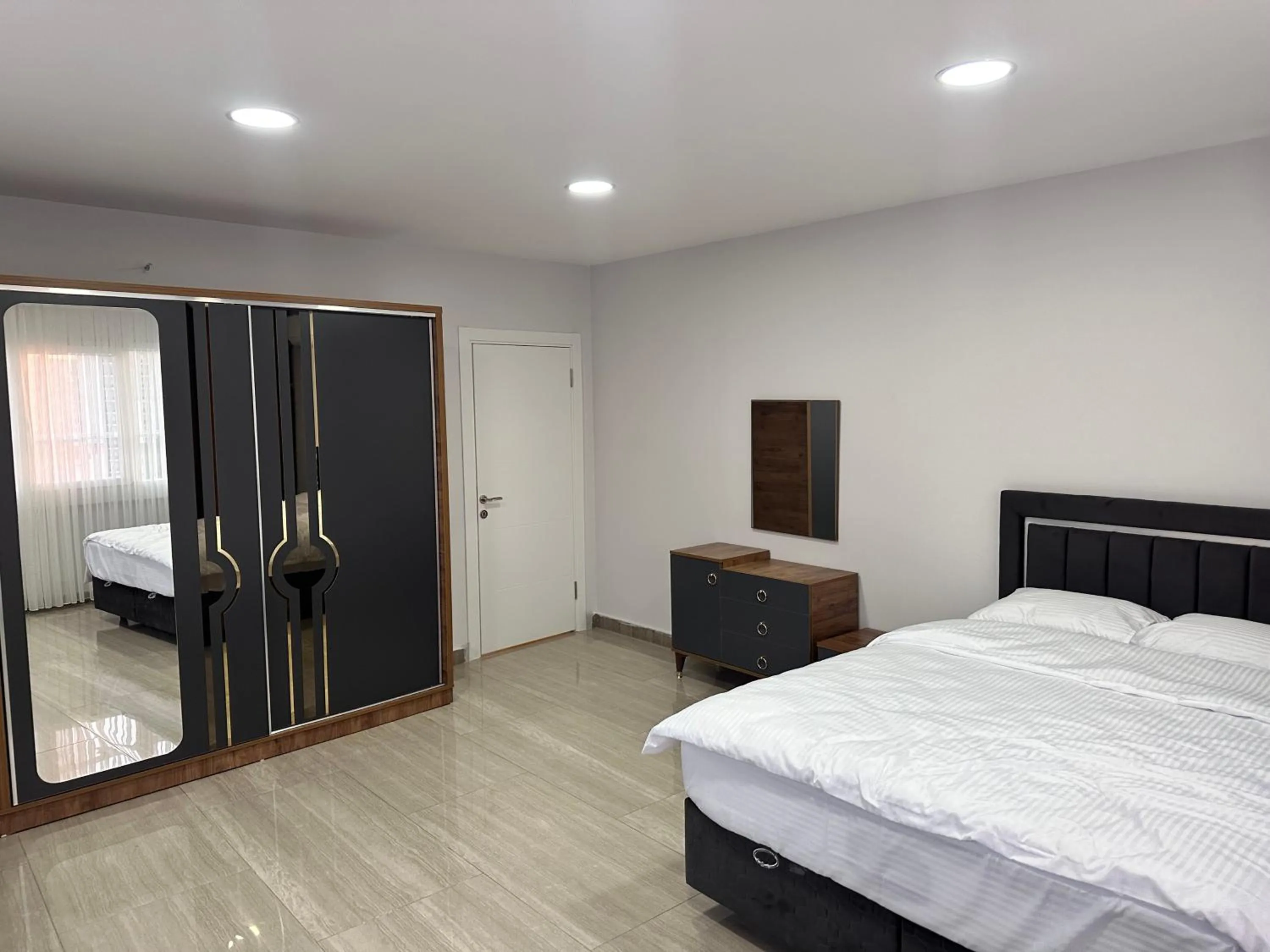 Bed in Lumiera Suites Hotel