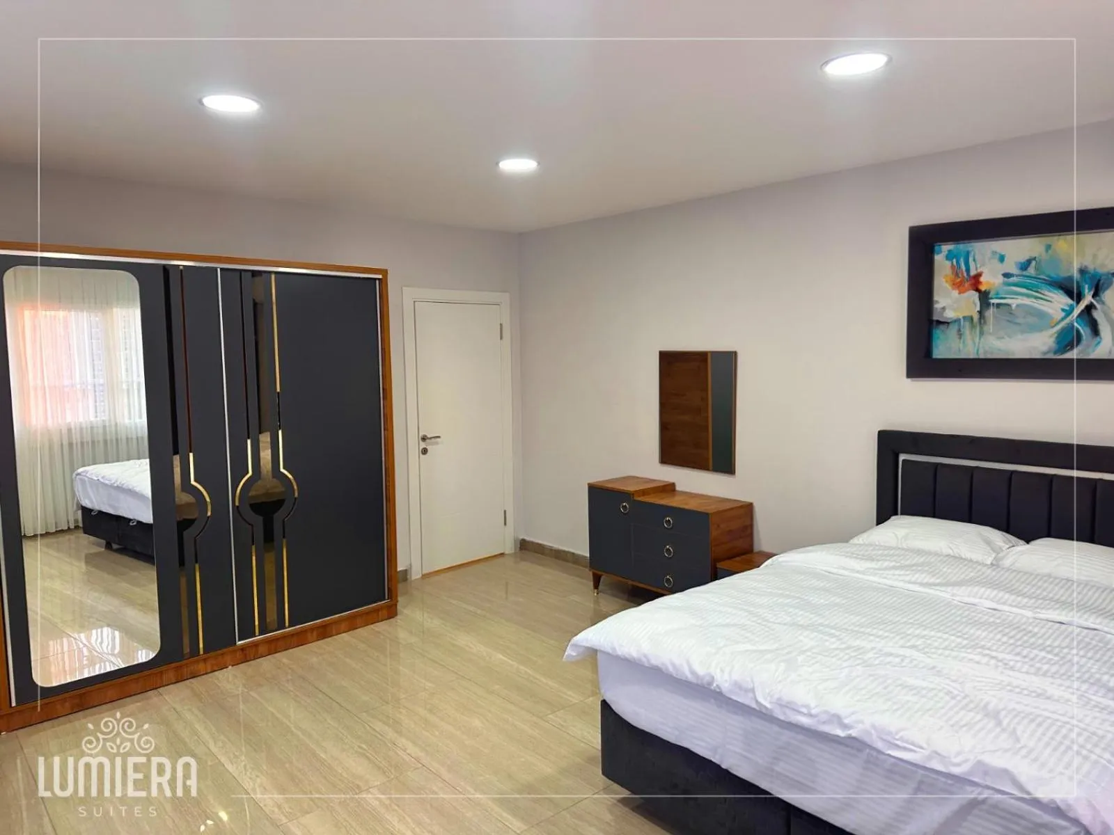 Bed in Lumiera Suites Hotel