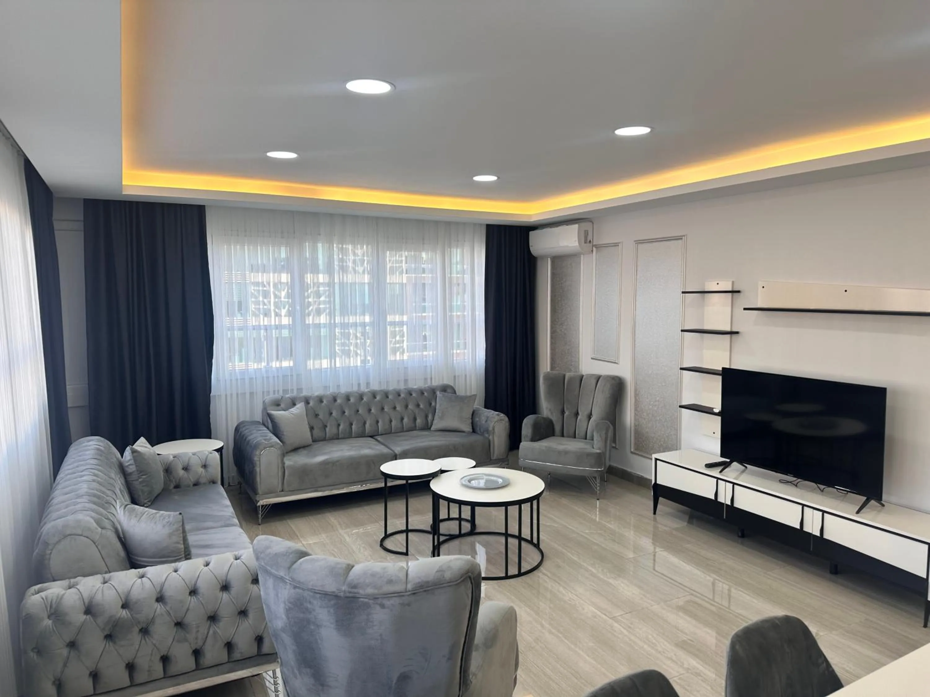 Communal lounge/ TV room in Lumiera Suites Hotel