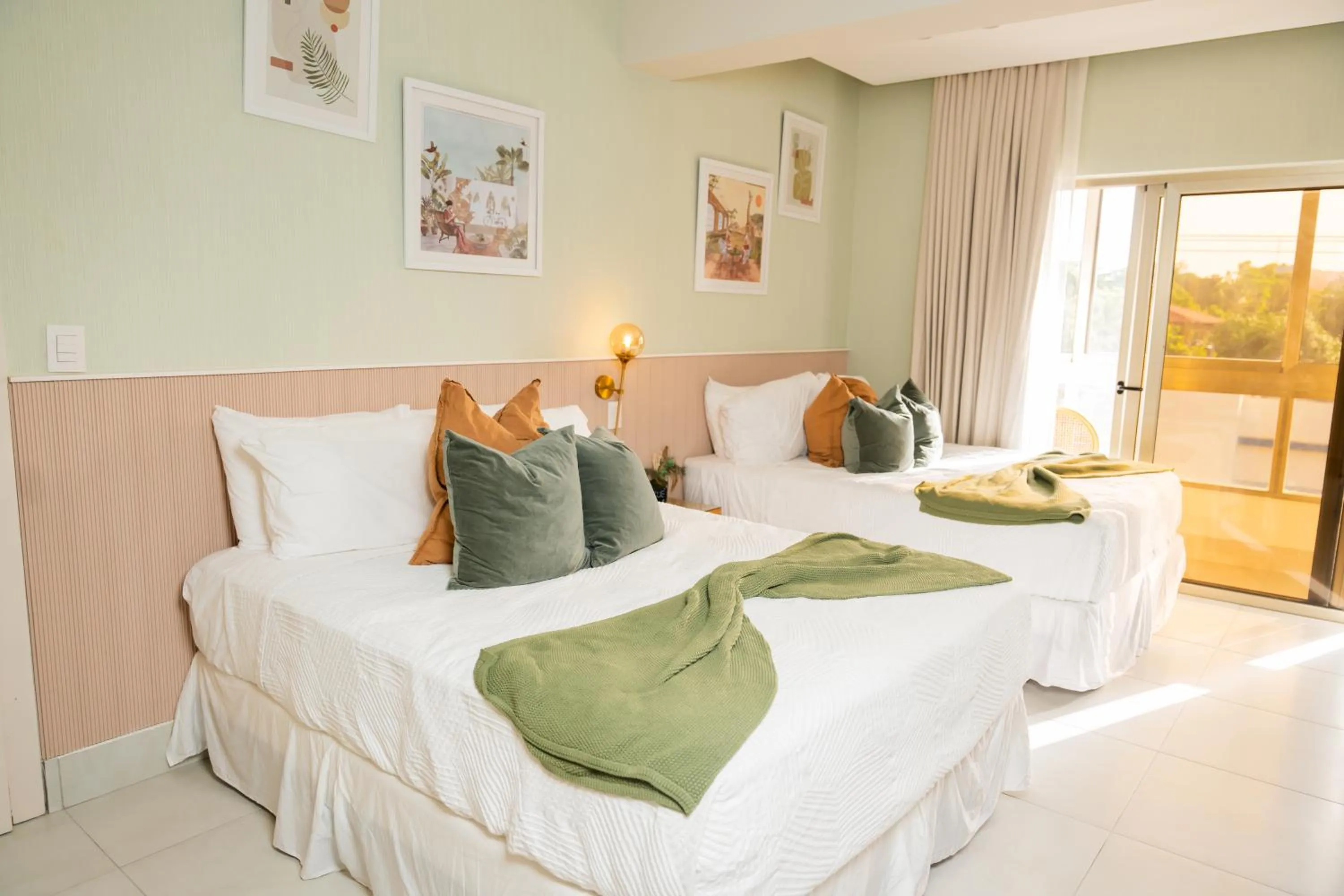 Bed in Hotel Stay Here Suites