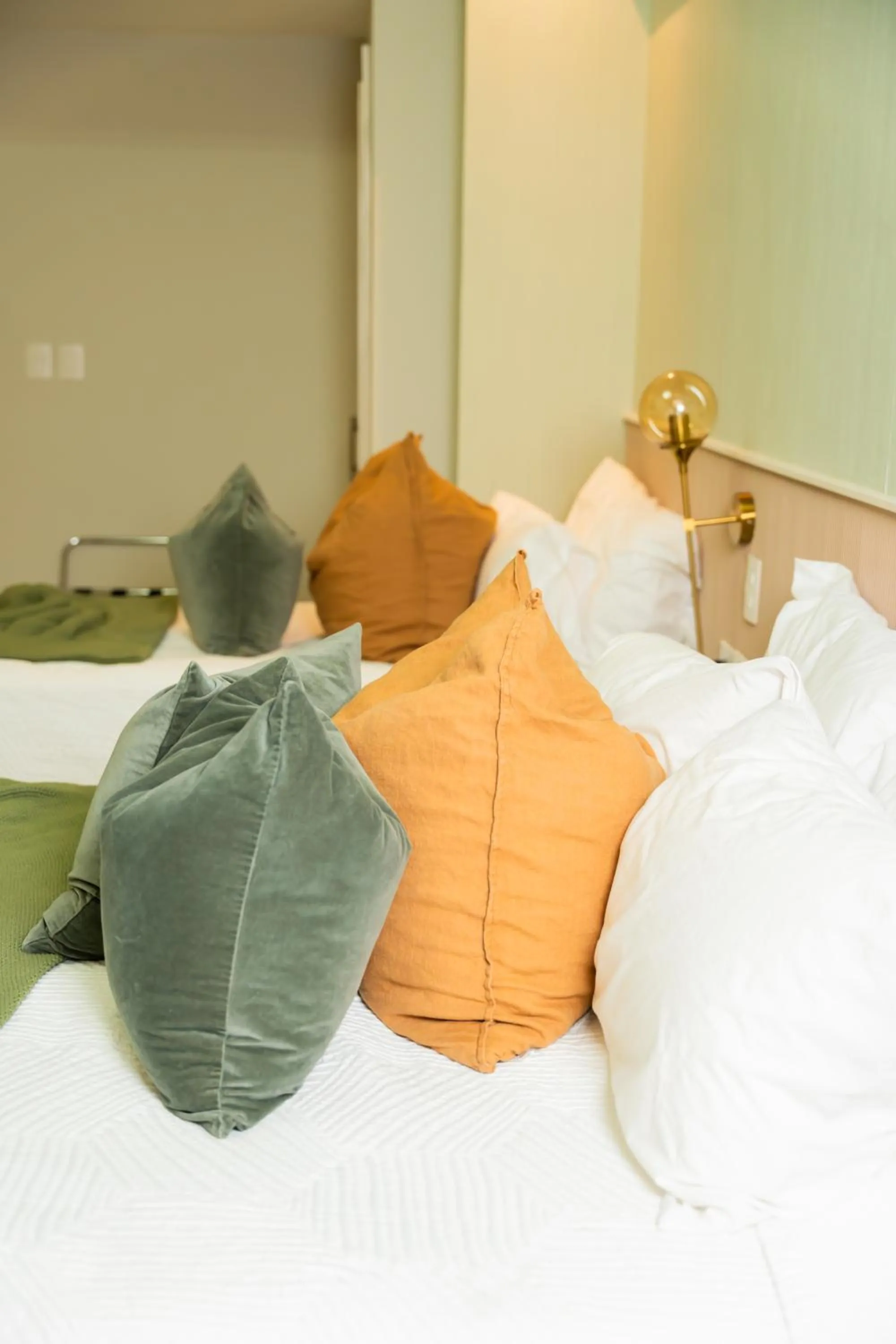 Bed in Hotel Stay Here Suites