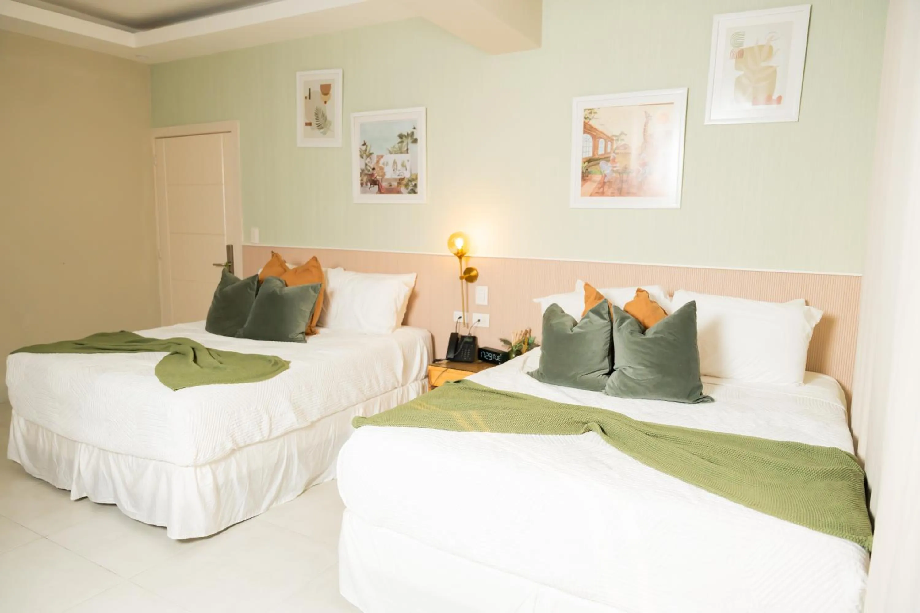 Bed in Hotel Stay Here Suites