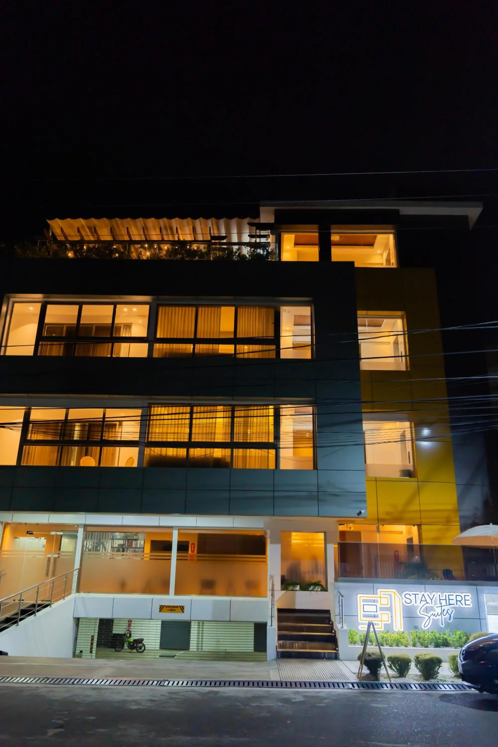 Property building in Hotel Stay Here Suites