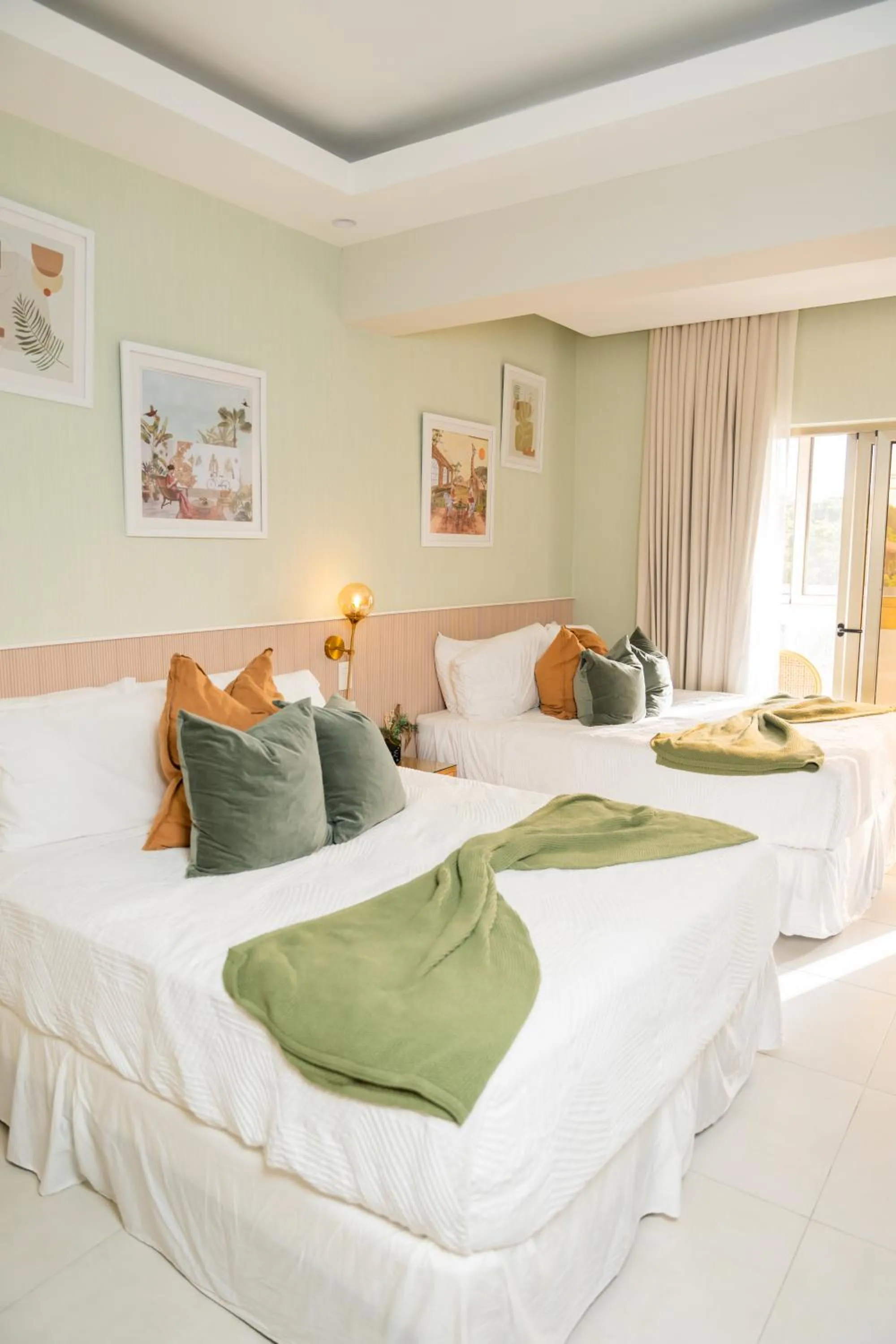 Bed in Hotel Stay Here Suites