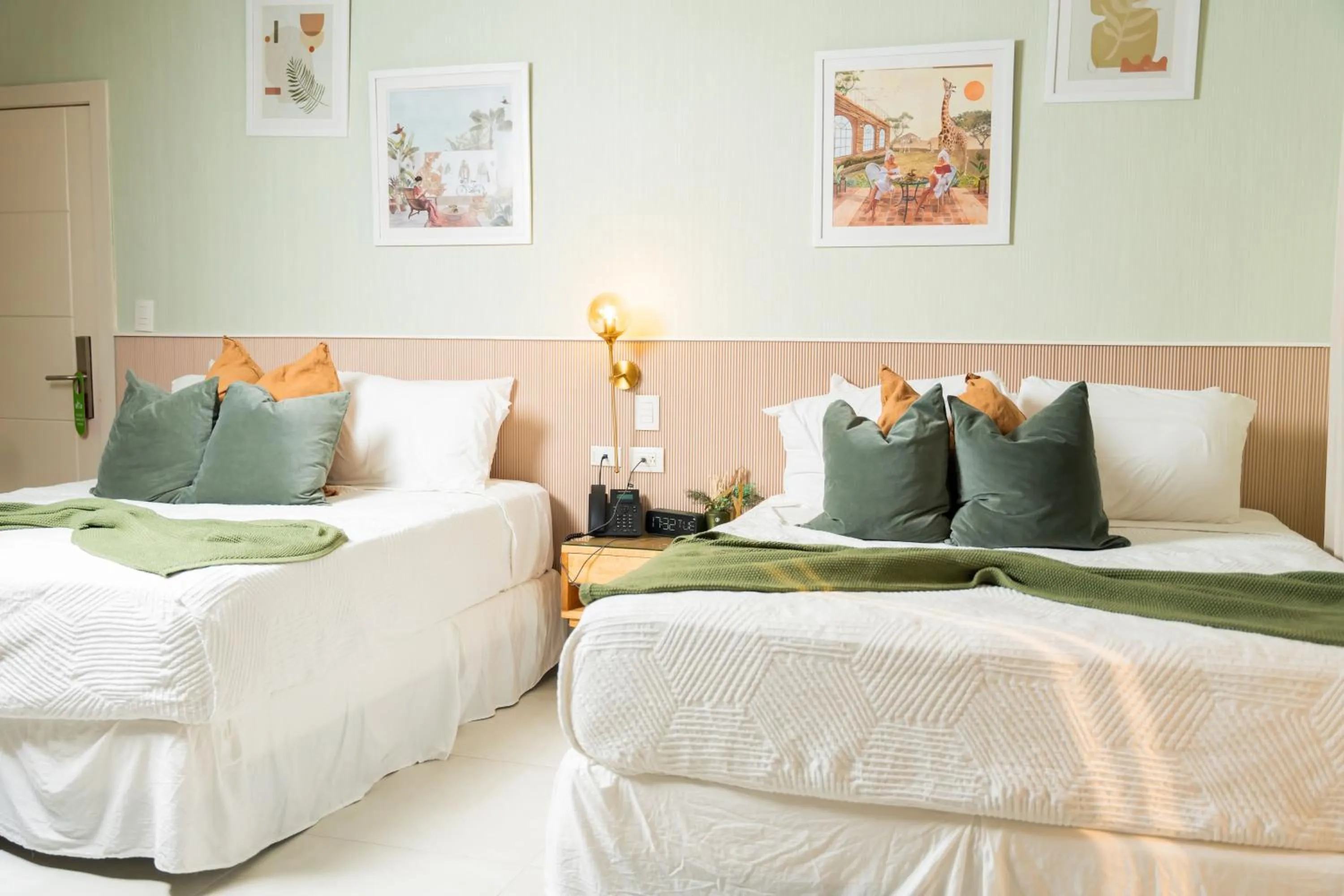 Bed in Hotel Stay Here Suites