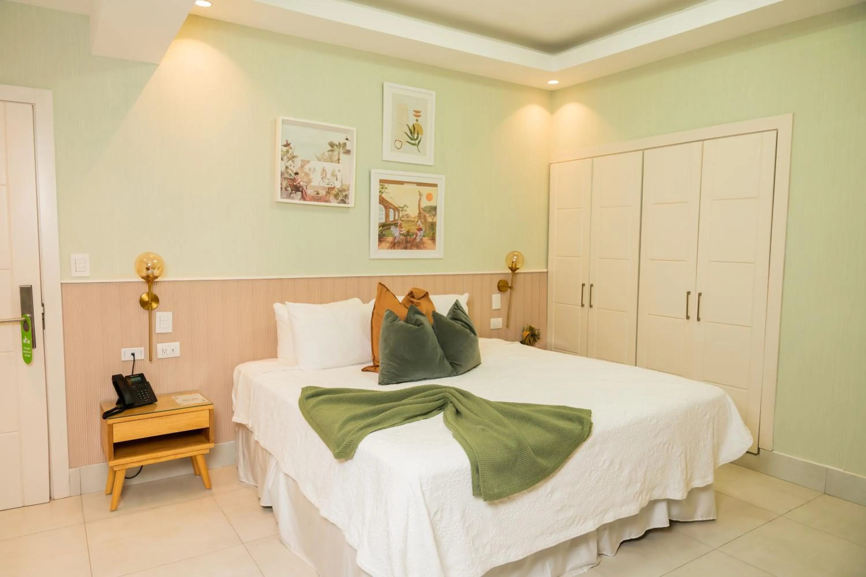 Bed in Hotel Stay Here Suites