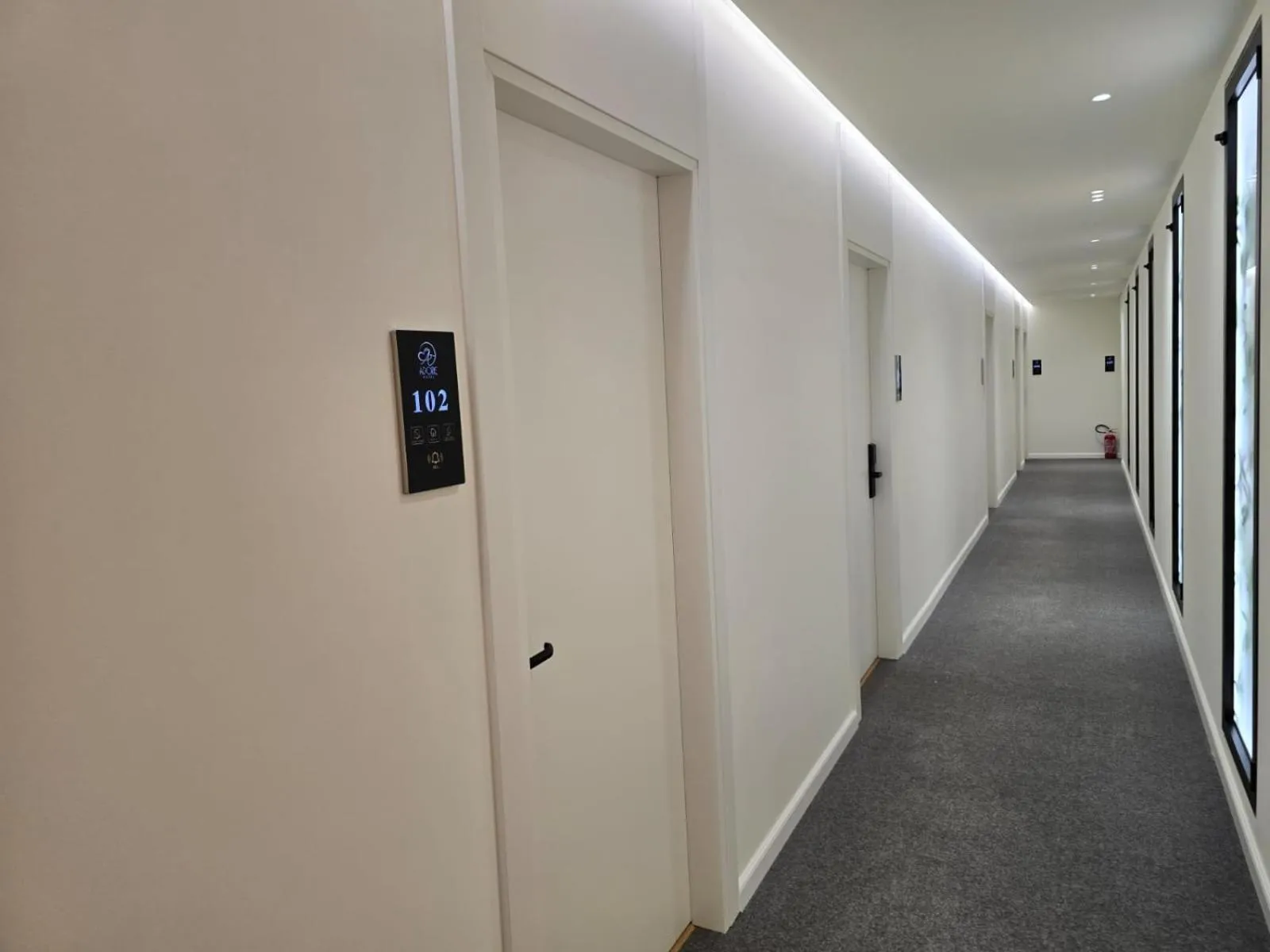 Property logo or sign in Hotel Adore