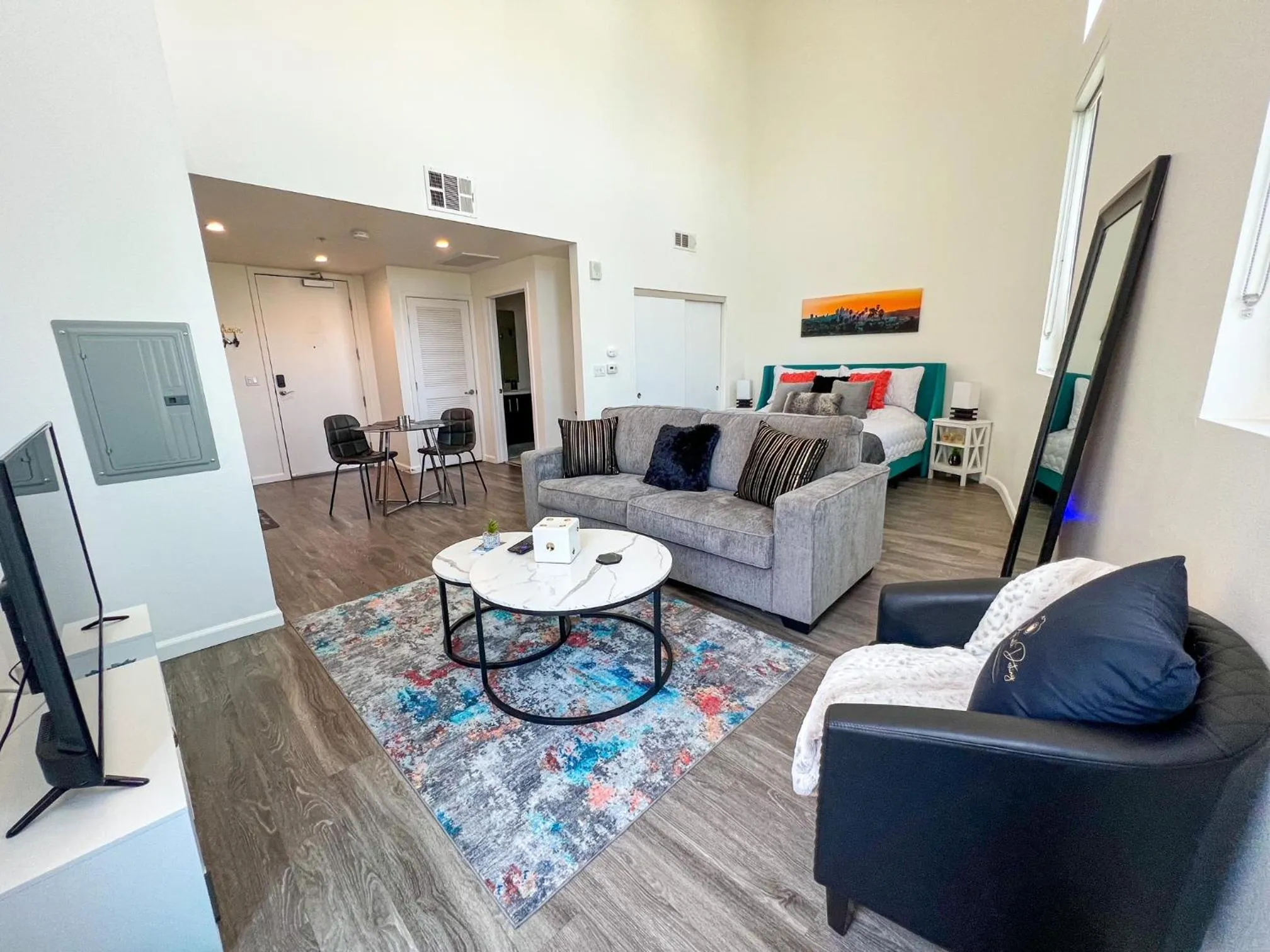 Communal lounge/ TV room in Downtown Los Angeles Skyline balcony view Modern Penthouse