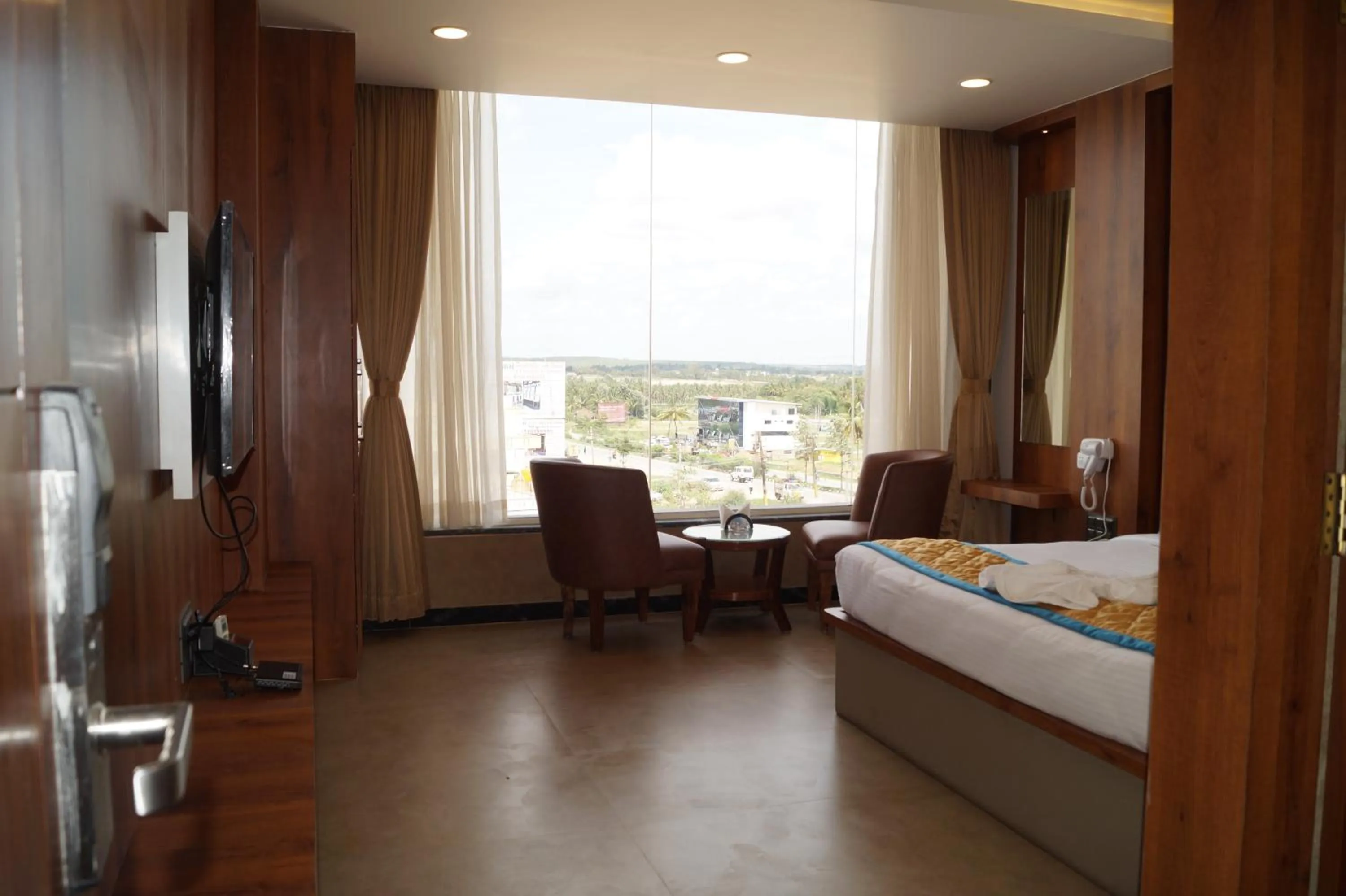 Bed in Hotel Varun Mansion Hassan