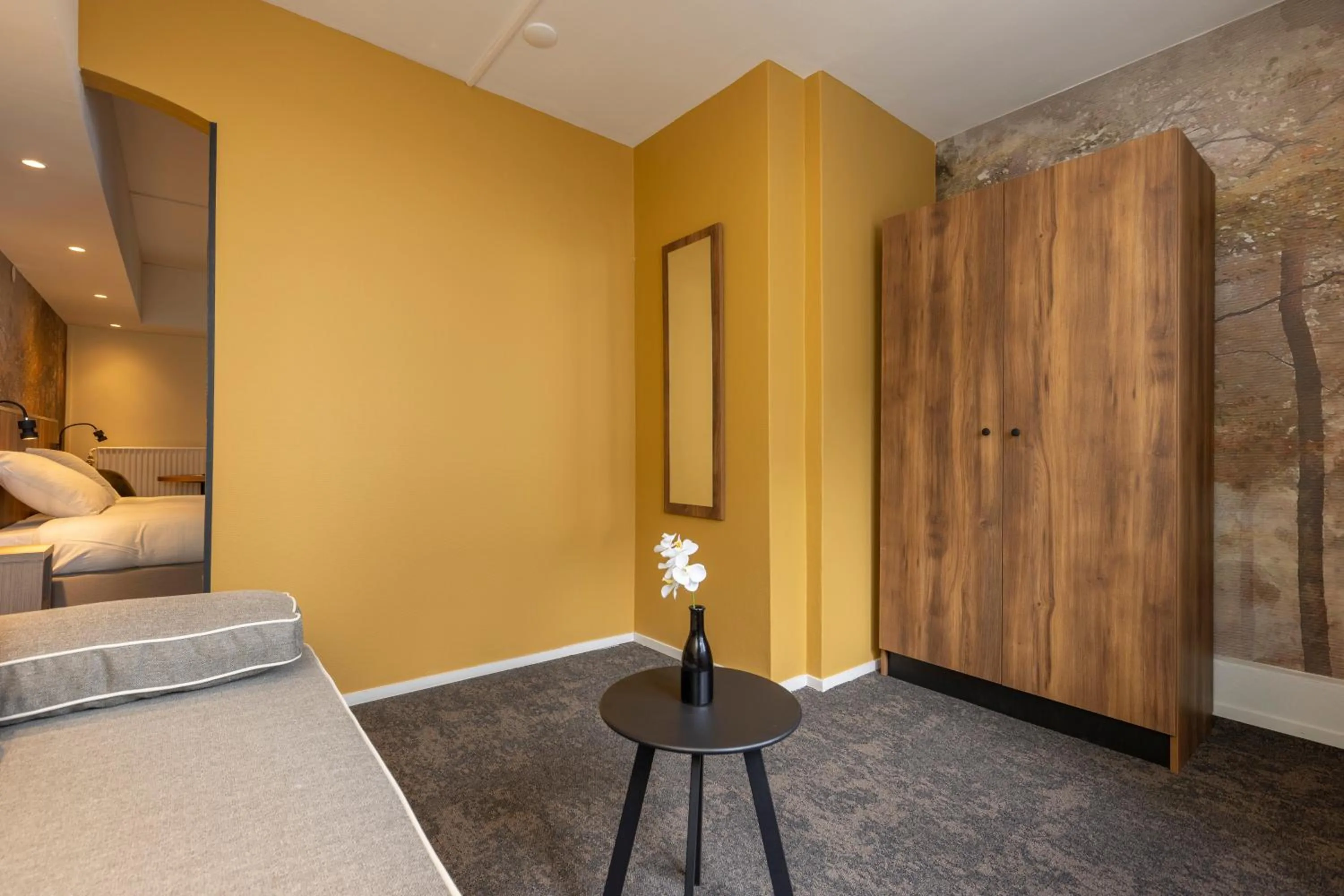 Seating area, Bed in Fletcher Hotel Restaurant Erica