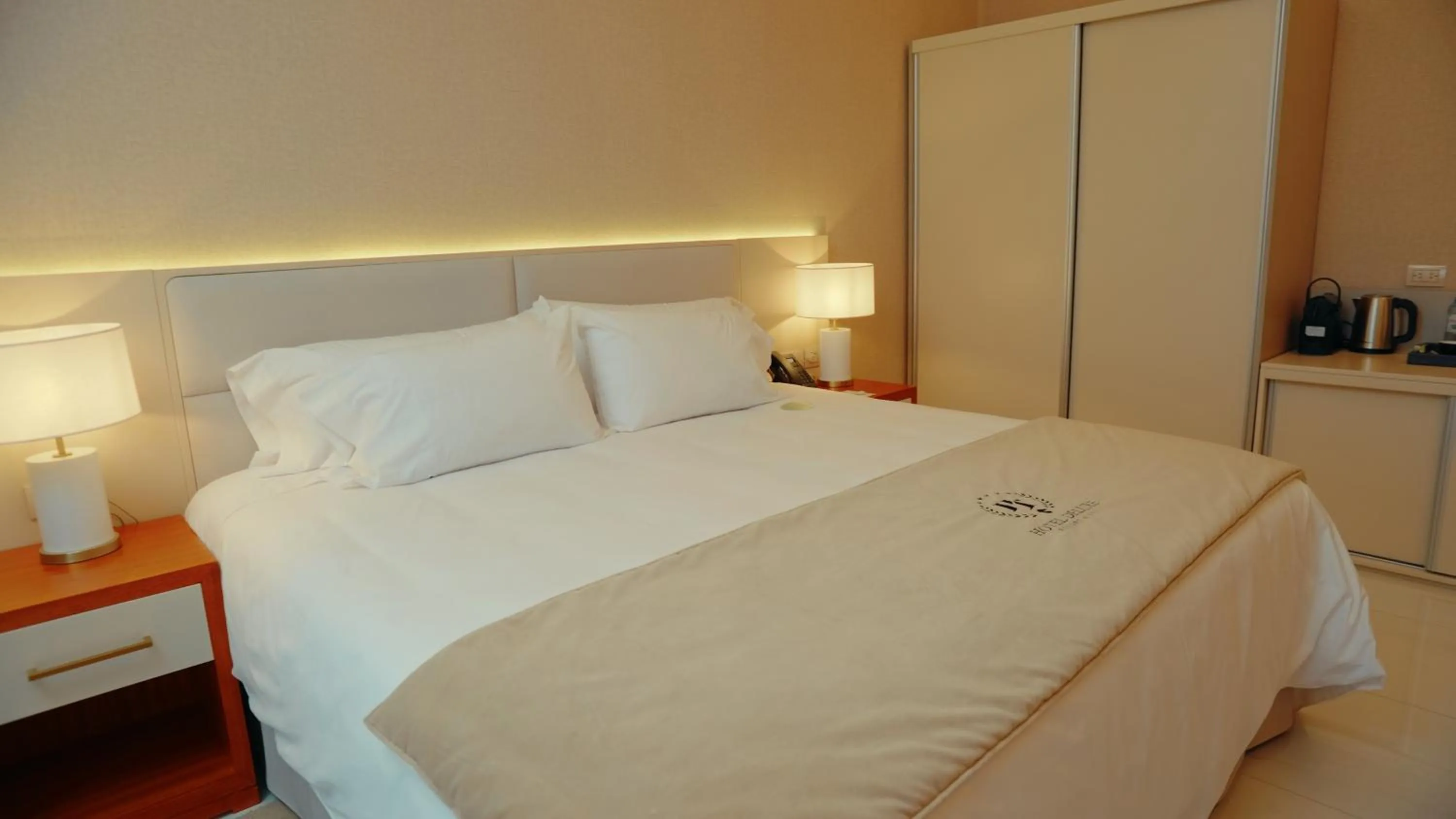 Bedroom in HT Hotel Deluxe Resort & SPA