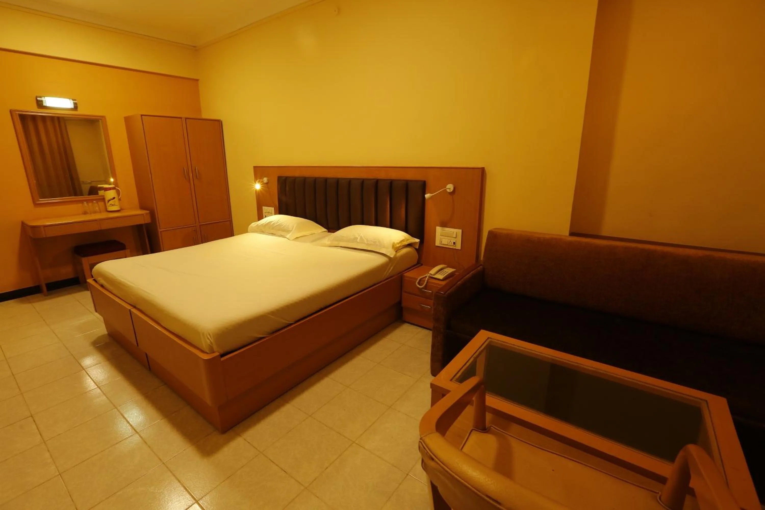 Photo of the whole room, Bed in Hotel Ravikiran Alibaug