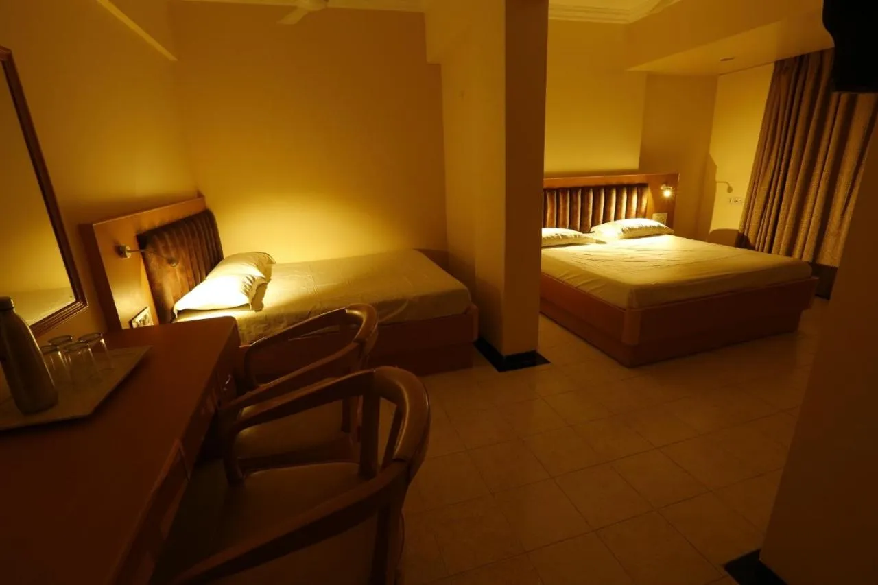 Bed in Hotel Ravikiran Alibaug