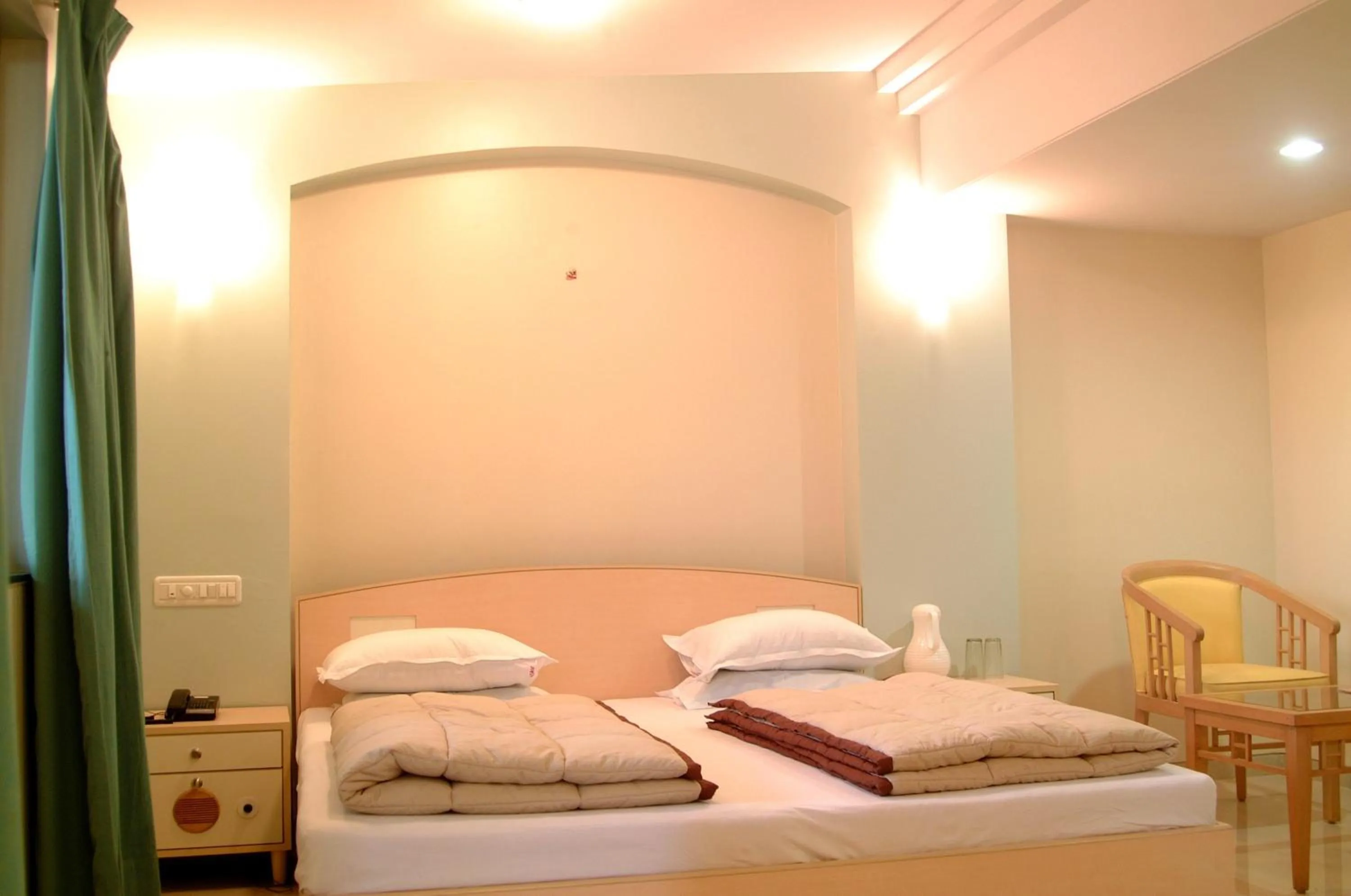 Bed in Hotel Ravikiran Alibaug