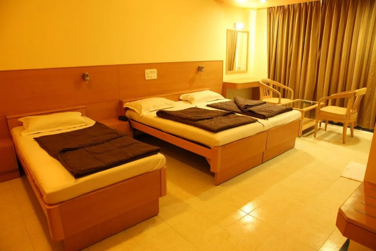 Bed in Hotel Ravikiran Alibaug