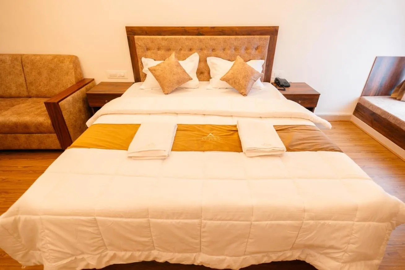 Bed in Uptown Suites