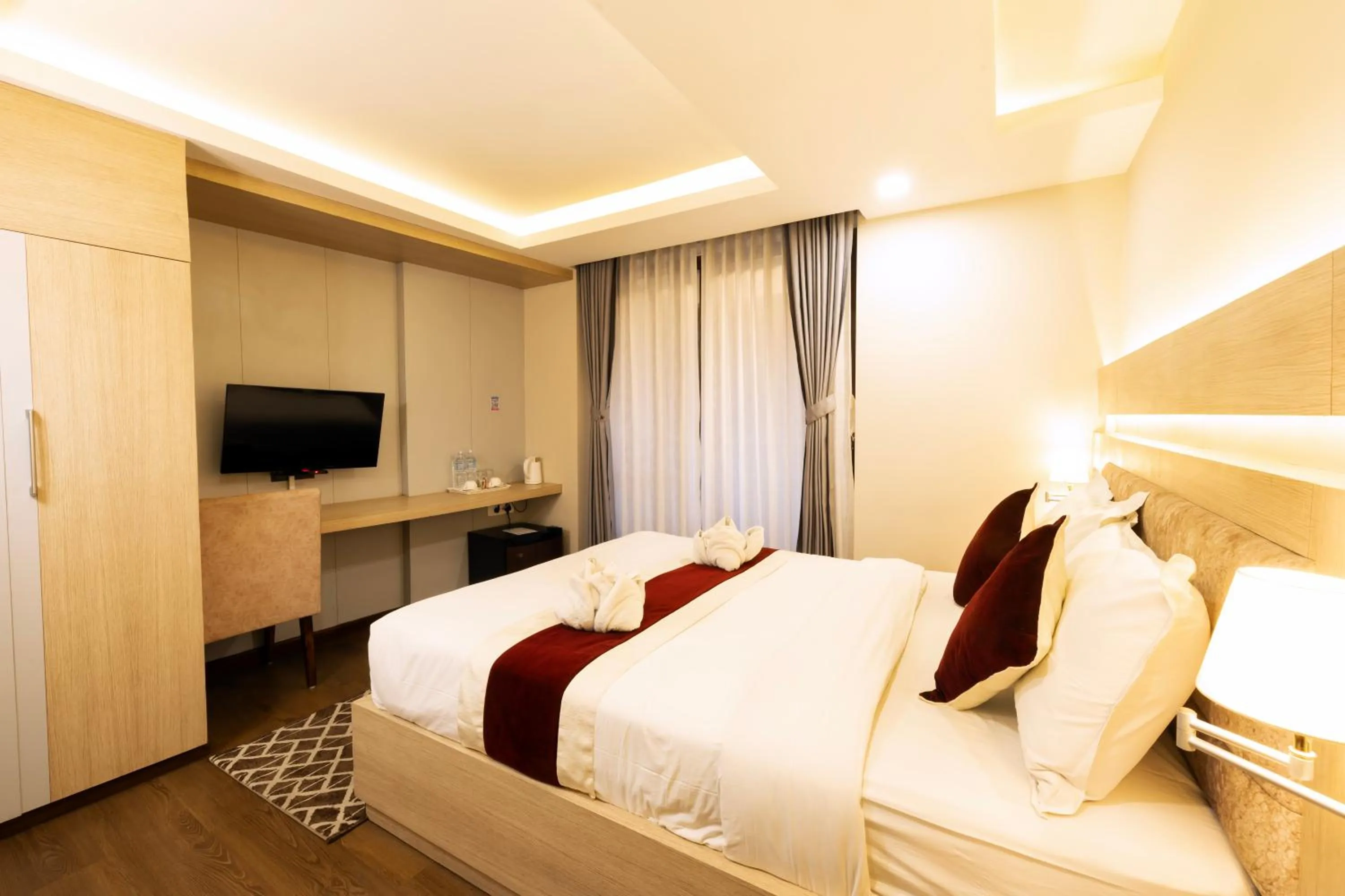 Bed in Divine Kathmandu Hotel