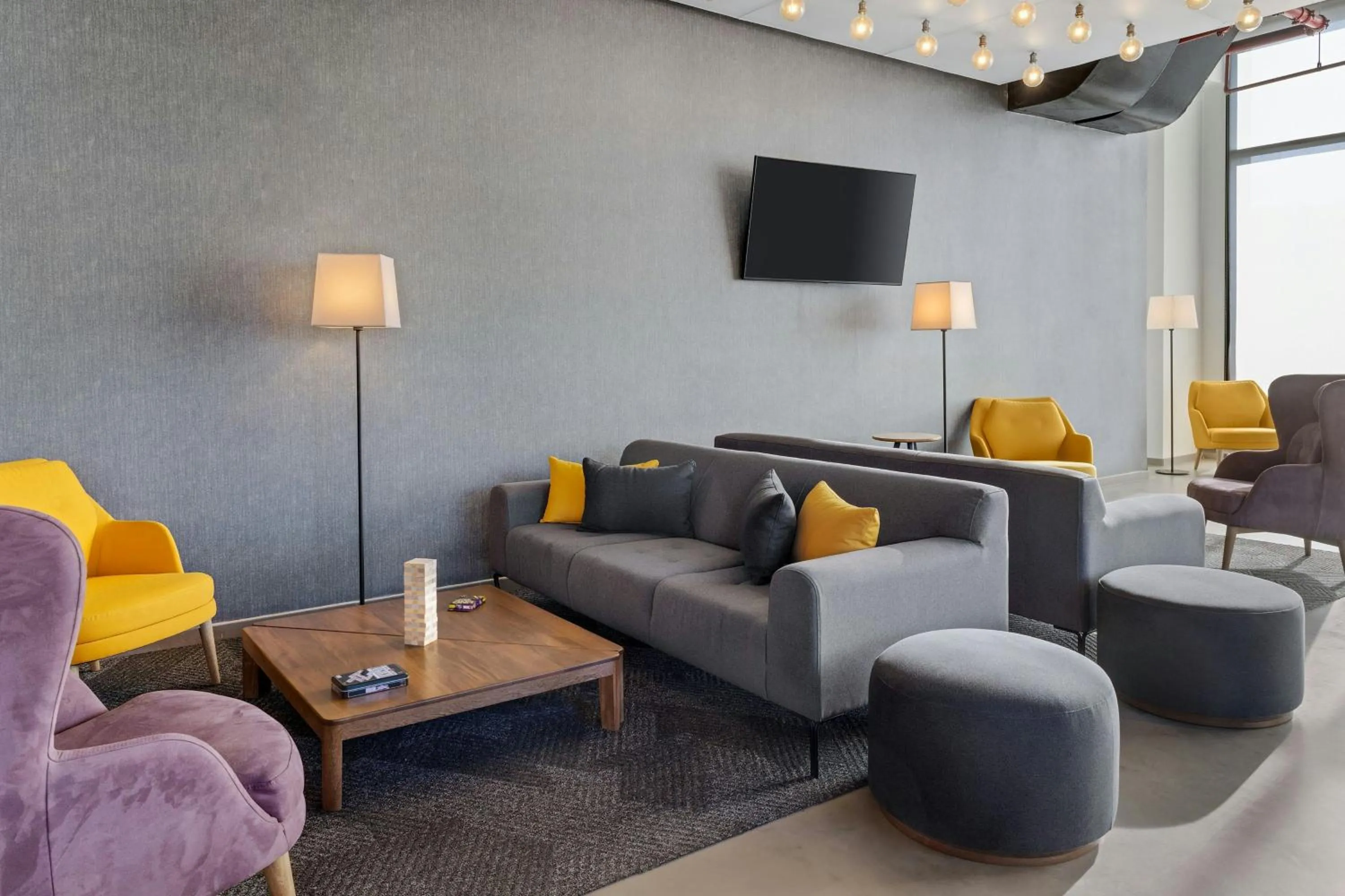 Communal lounge/ TV room in Aloft Santo Domingo Piantini