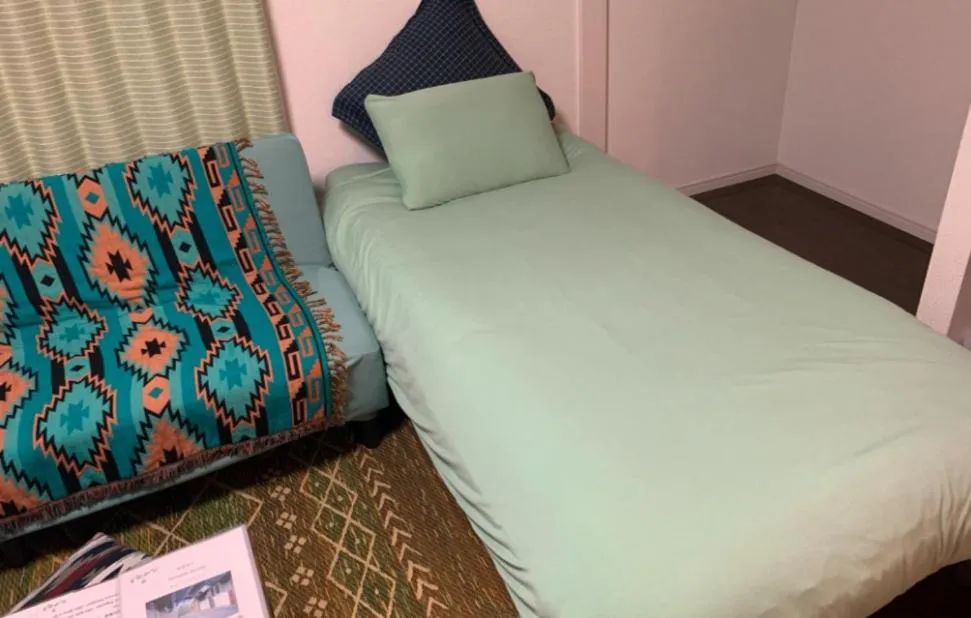 Bed in Oyado Kinokuniya Daikokumachi