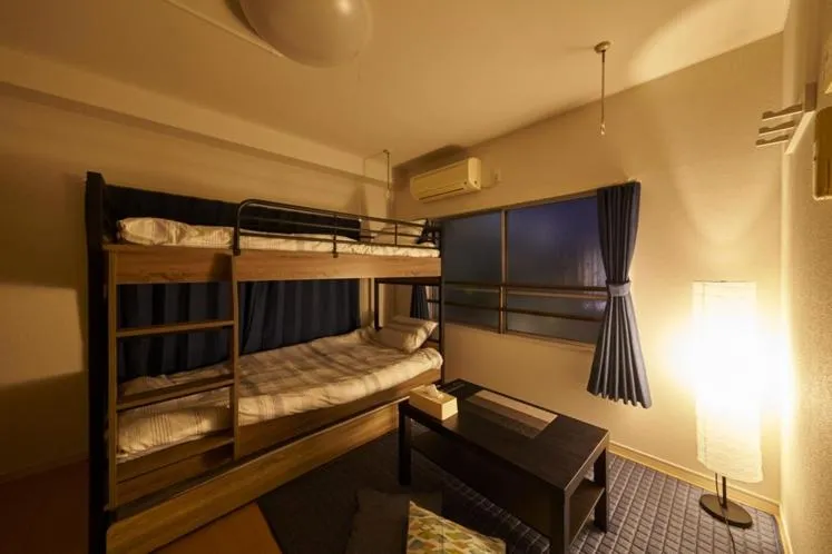 Bed in Oyado Kinokuniya Daikokumachi