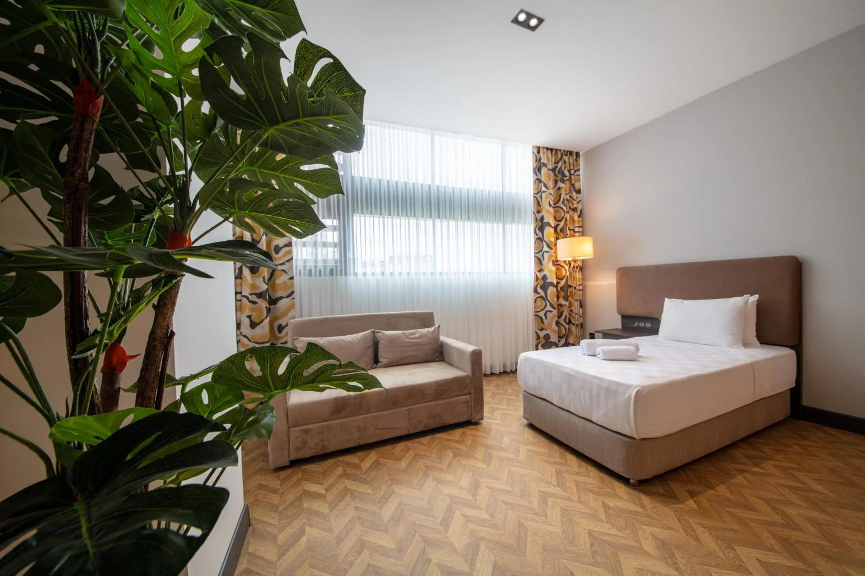 Bed in V Center Hotel