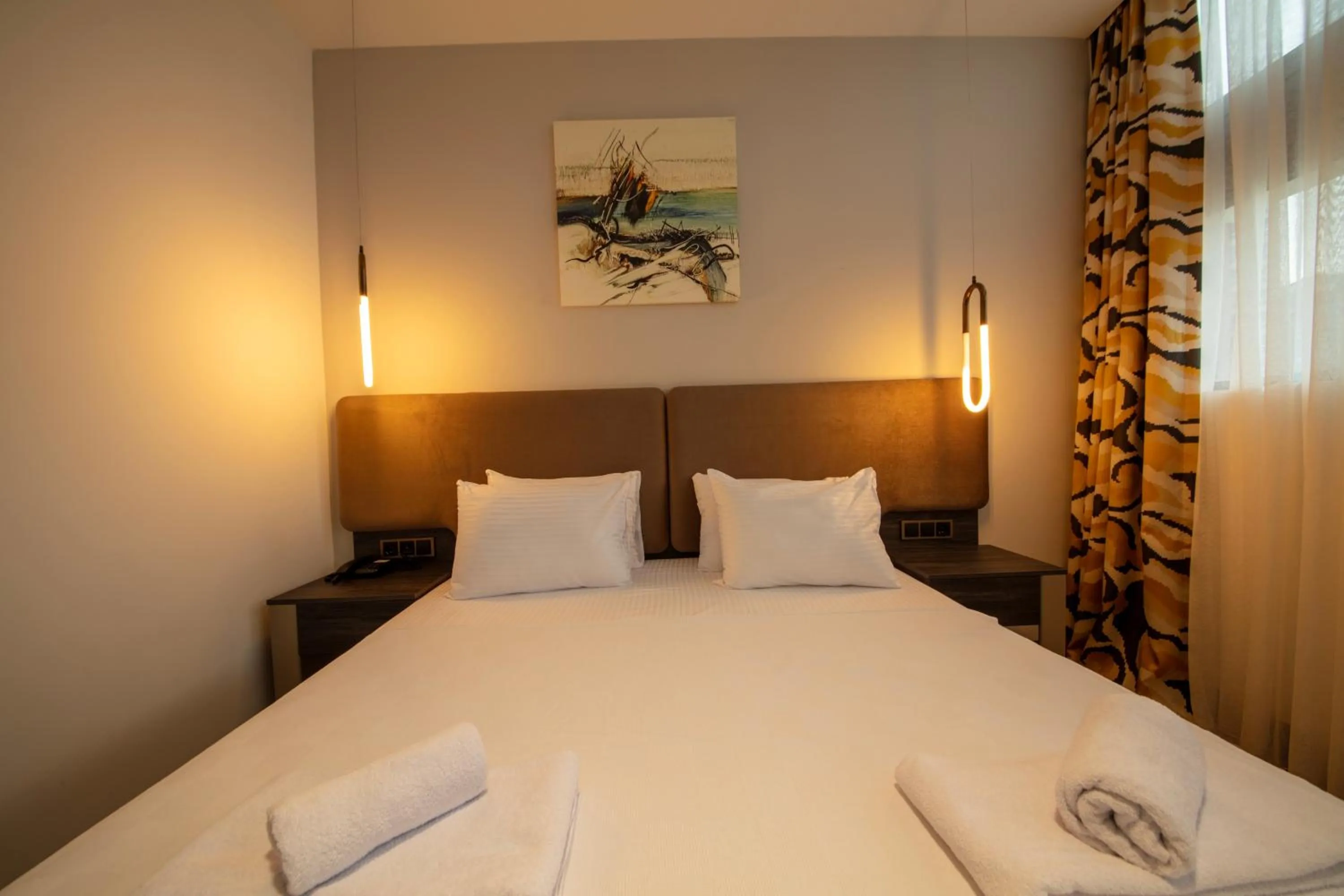 Bed in V Center Hotel