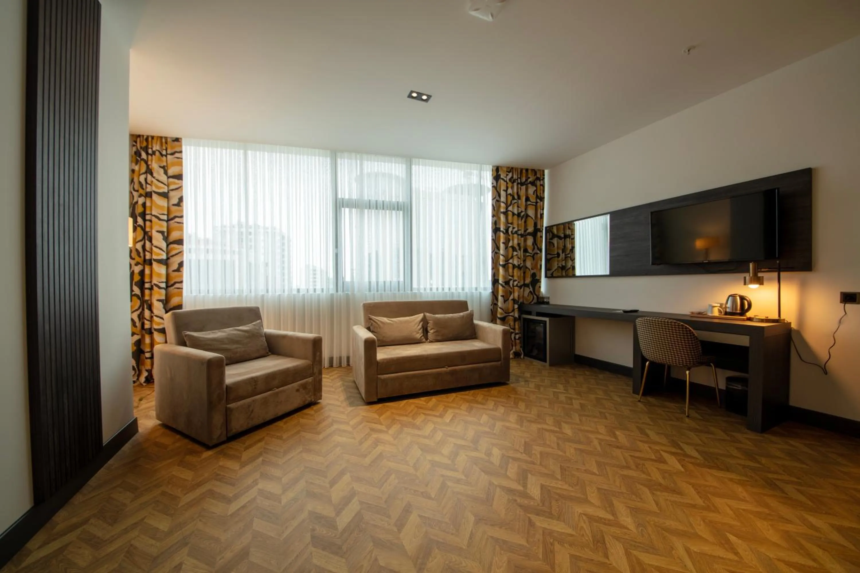 Communal lounge/ TV room in V Center Hotel