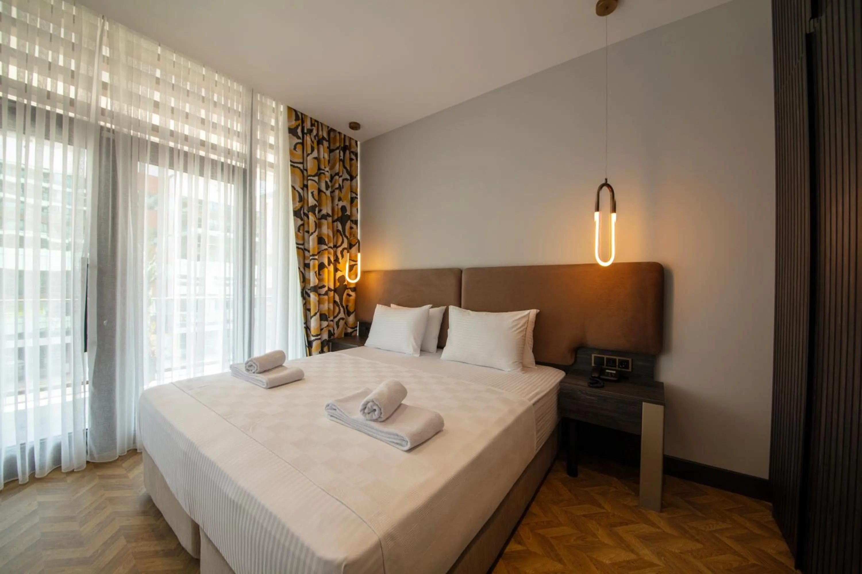 Photo of the whole room, Bed in V Center Hotel