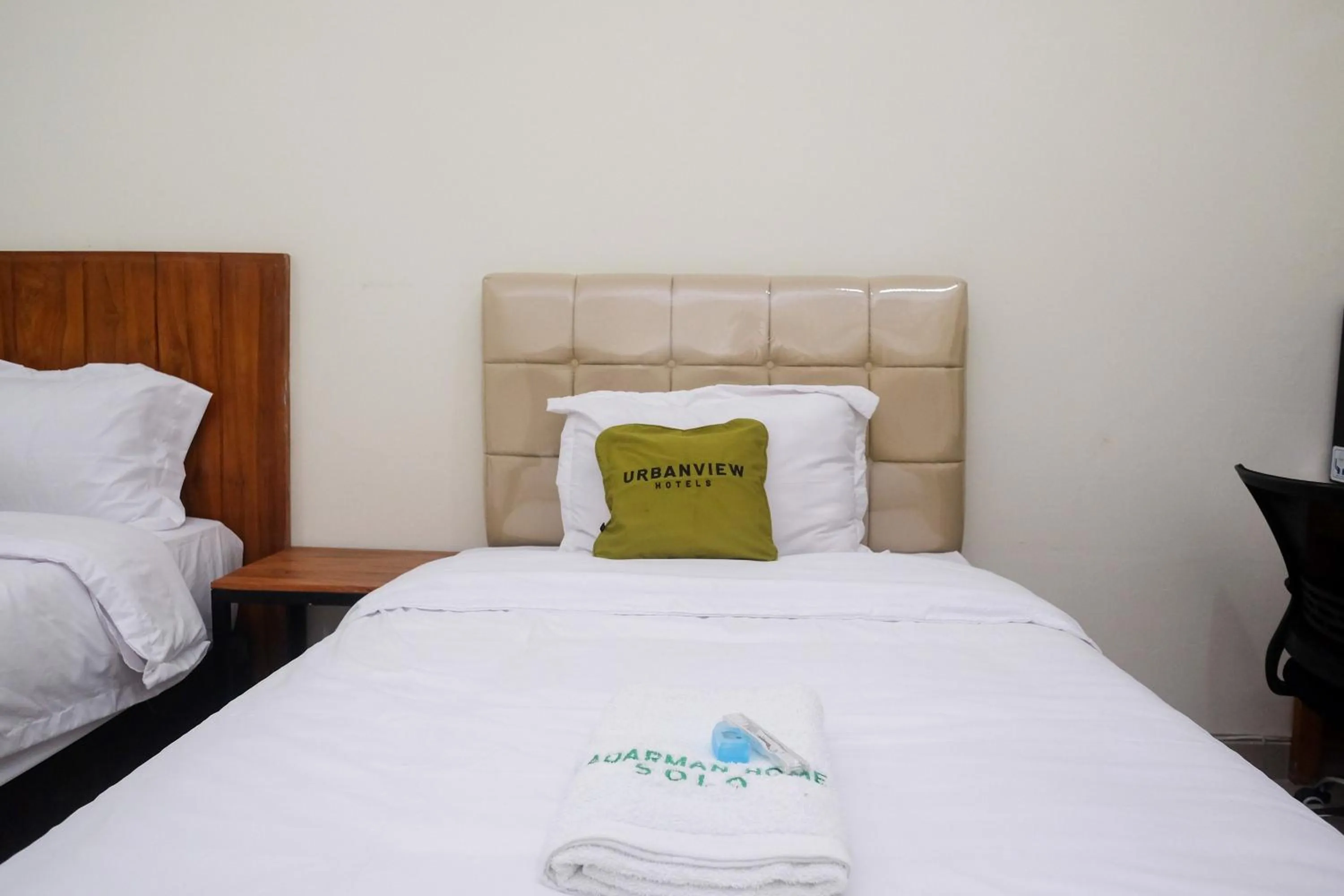 Bed in Urbanview Syariah Kadarman Home Laweyan by RedDoorz