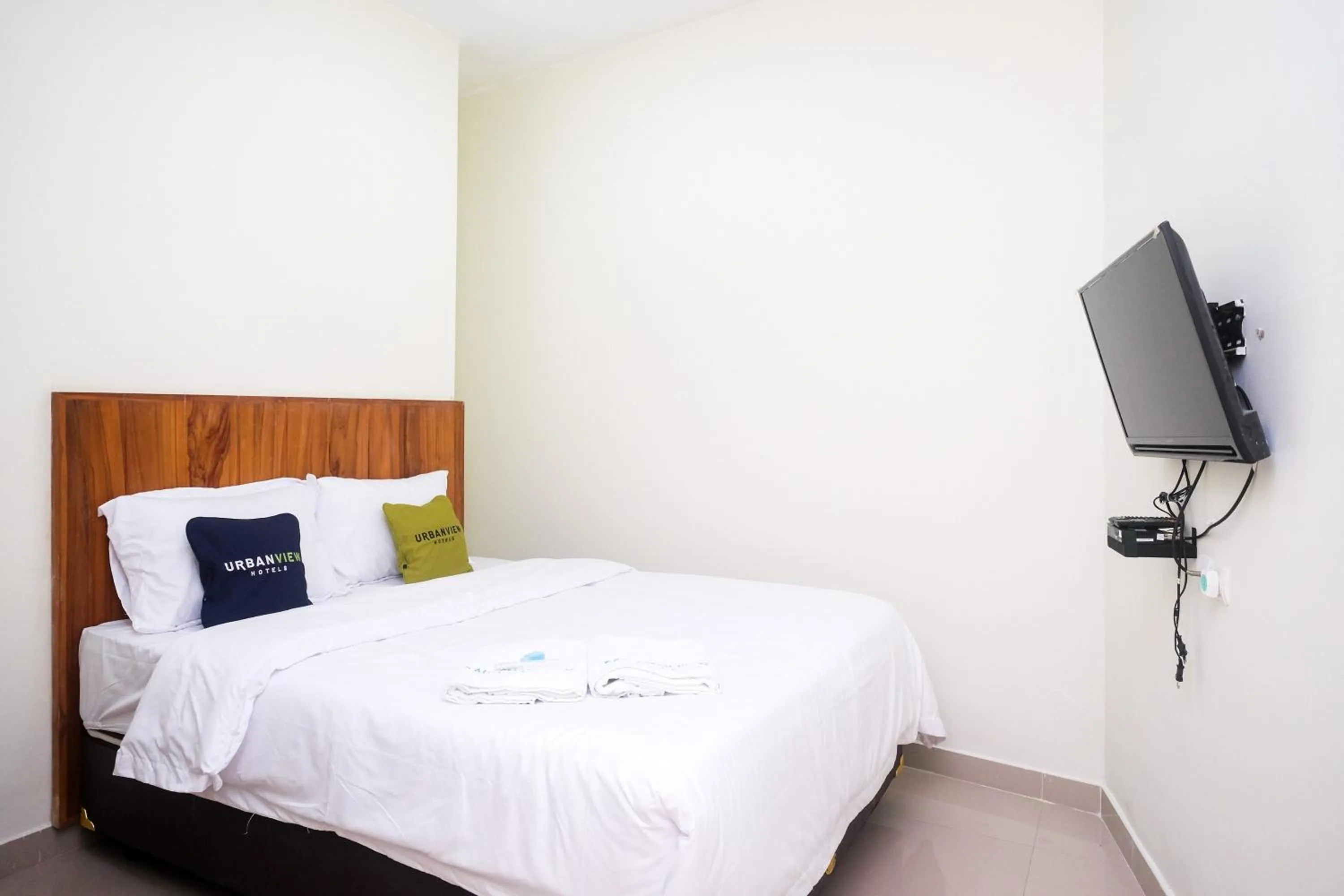 Bed in Urbanview Syariah Kadarman Home Laweyan by RedDoorz