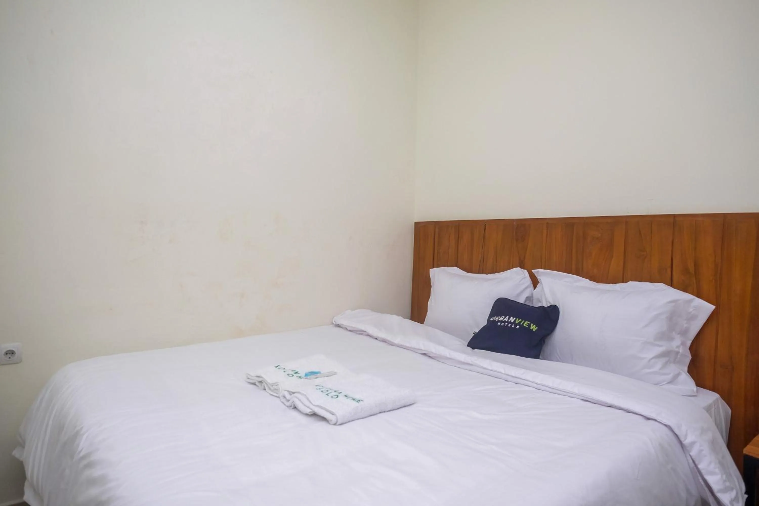 Bed in Urbanview Syariah Kadarman Home Laweyan by RedDoorz