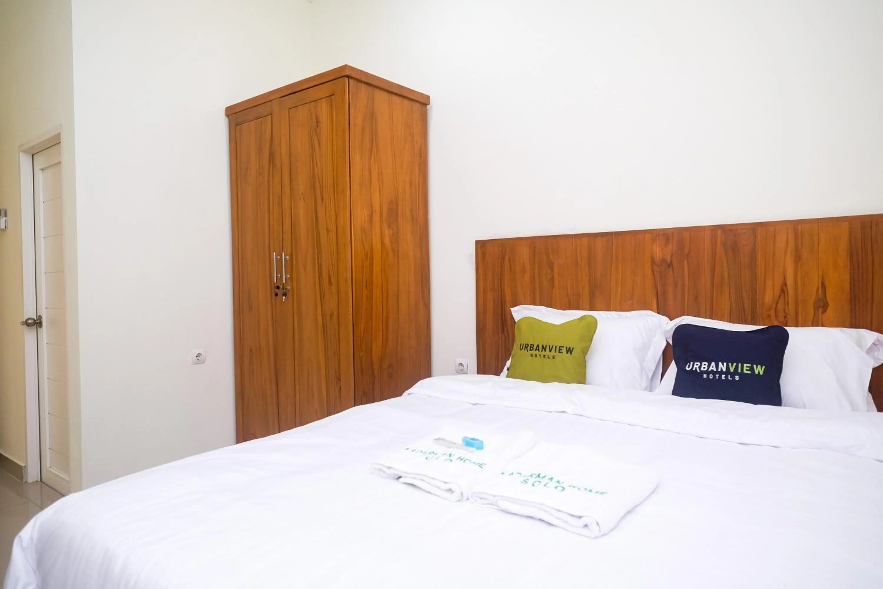 Bed in Urbanview Syariah Kadarman Home Laweyan by RedDoorz